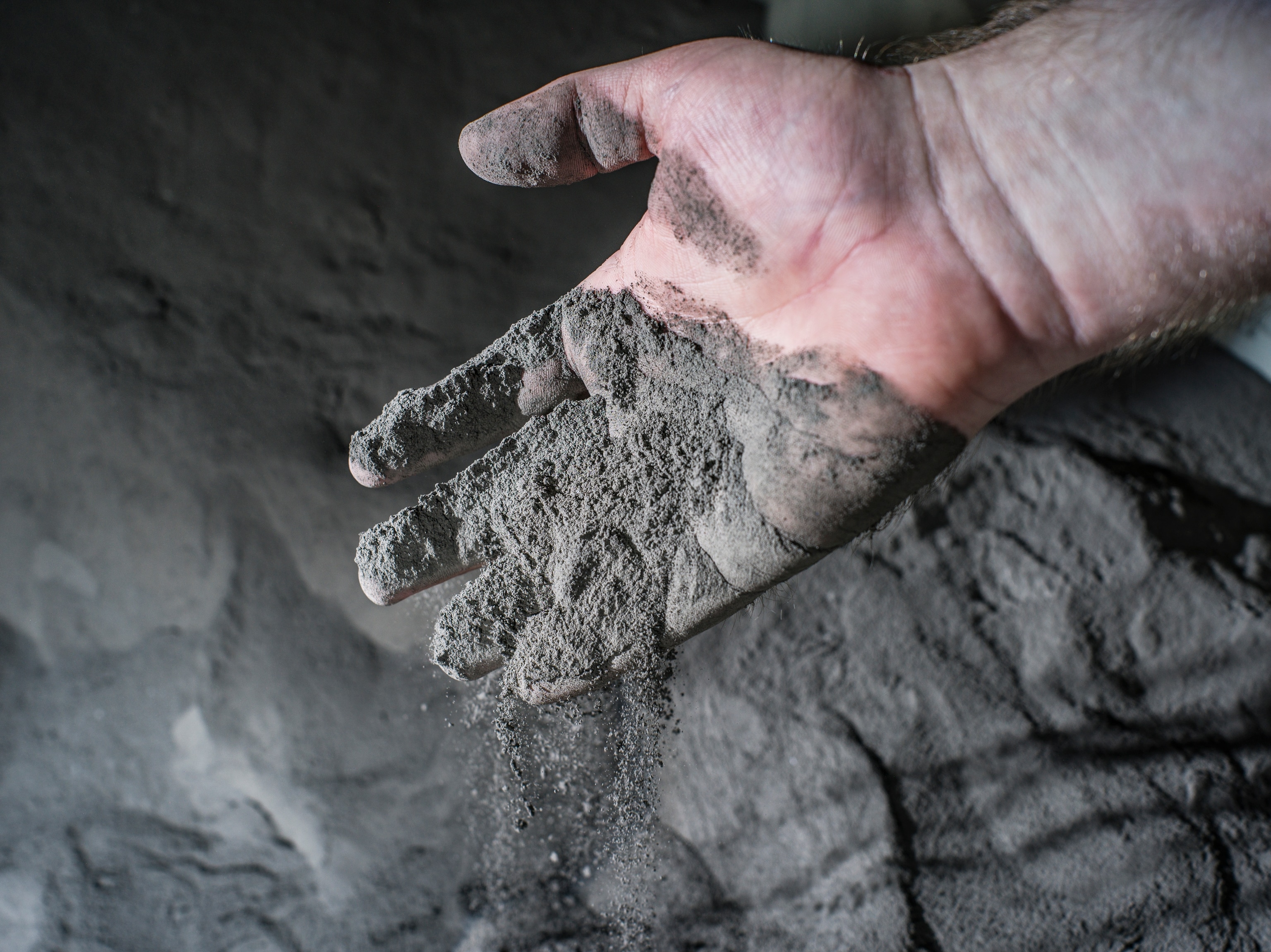 A hand in space dust illustrating how sticky it is and why it is an issue