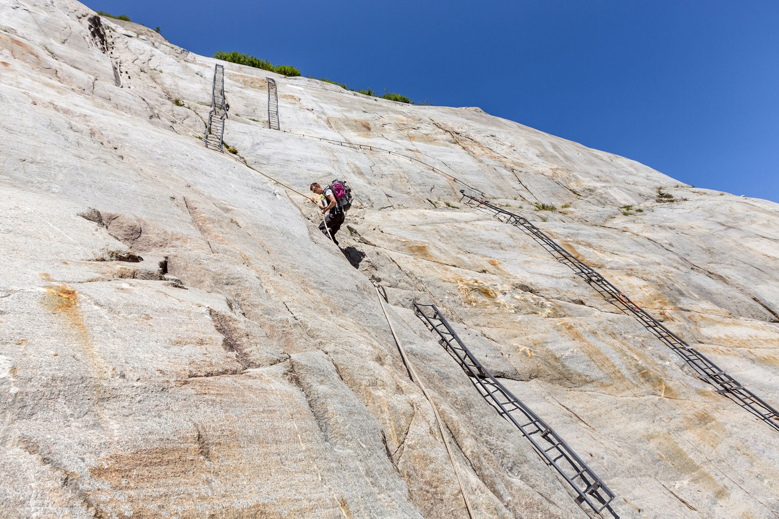 a climber on the via ferrata on the Mer de Glace glacier, France
