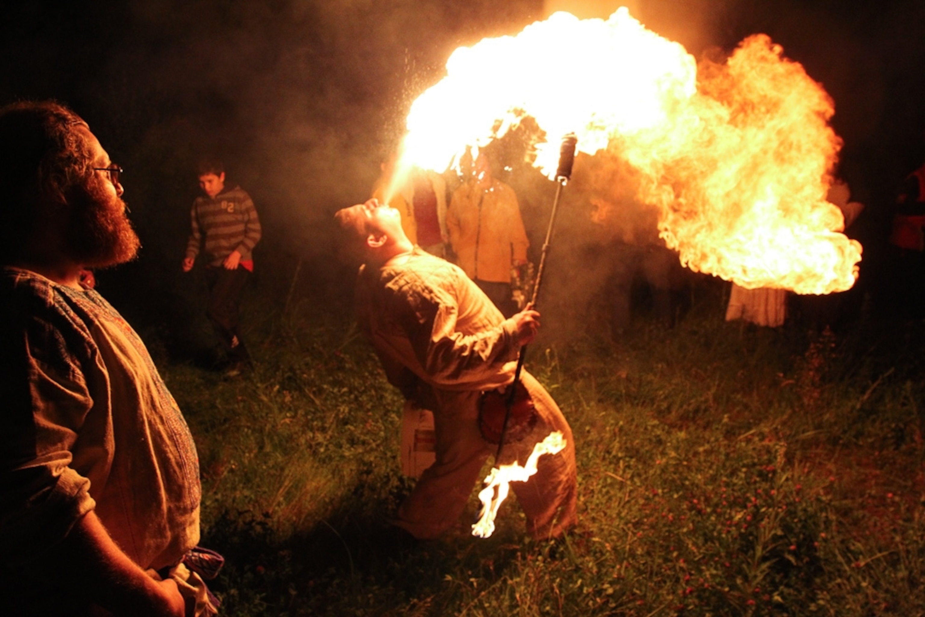 A picture of a Russian pagan putting on a fiery show at Kupalo, one of the summer solstice 2010 celebrations.