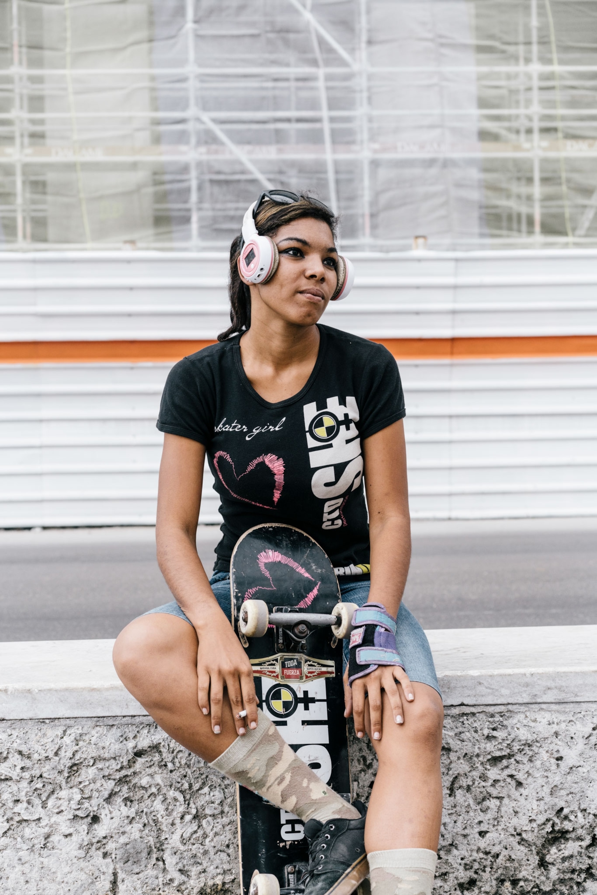 a girl wearing bluetooth headphones in Cuba