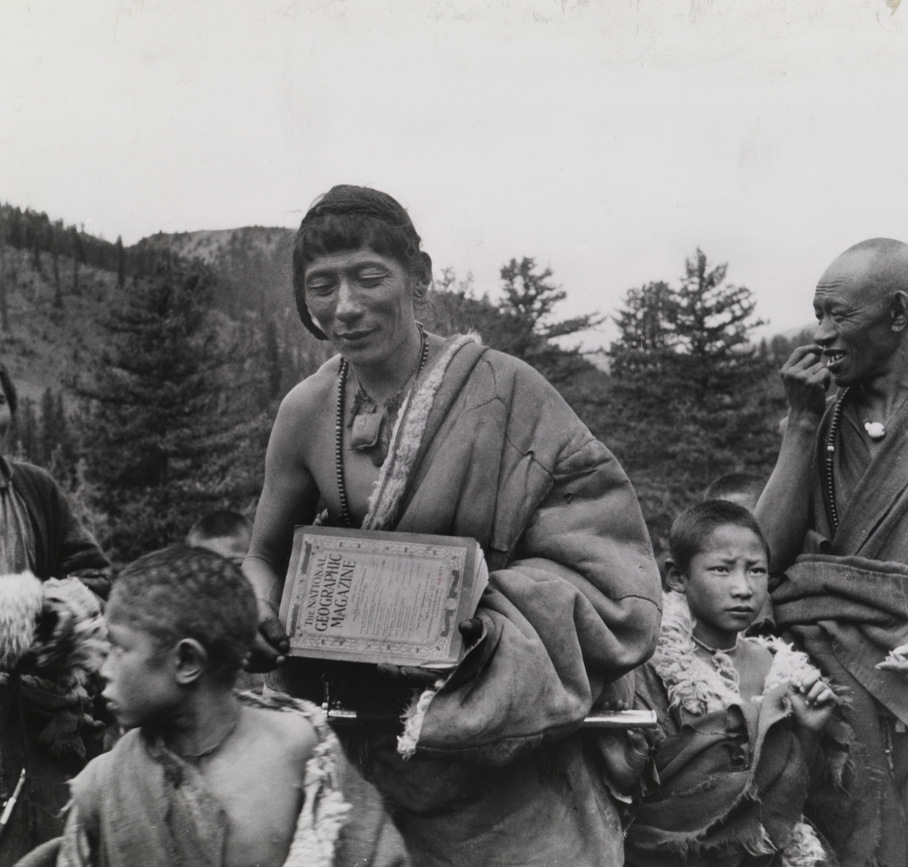 a person in China holding National Geographic Magazine