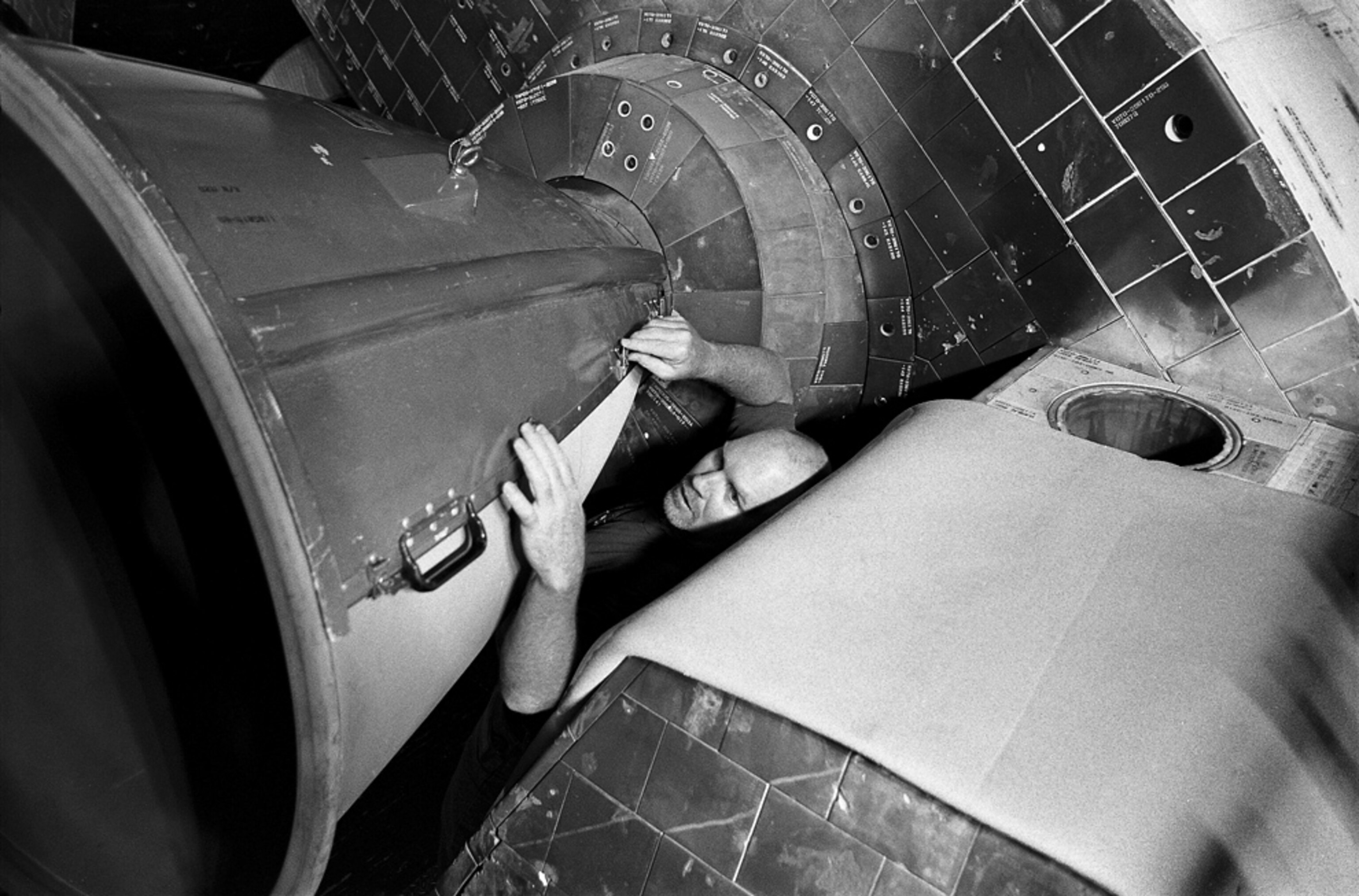 a technician working on a shuttle engine