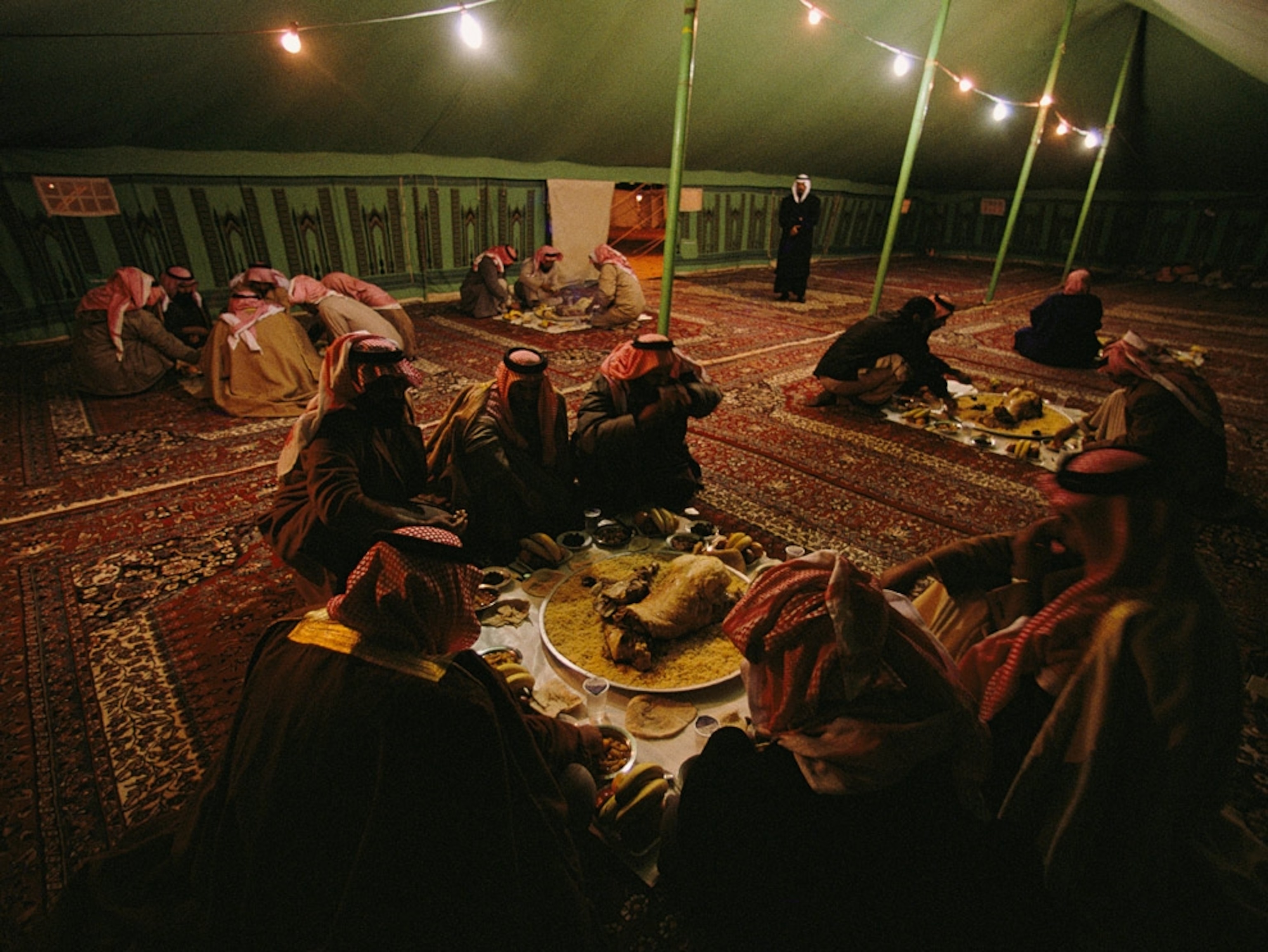 Bedouin men in a large tent