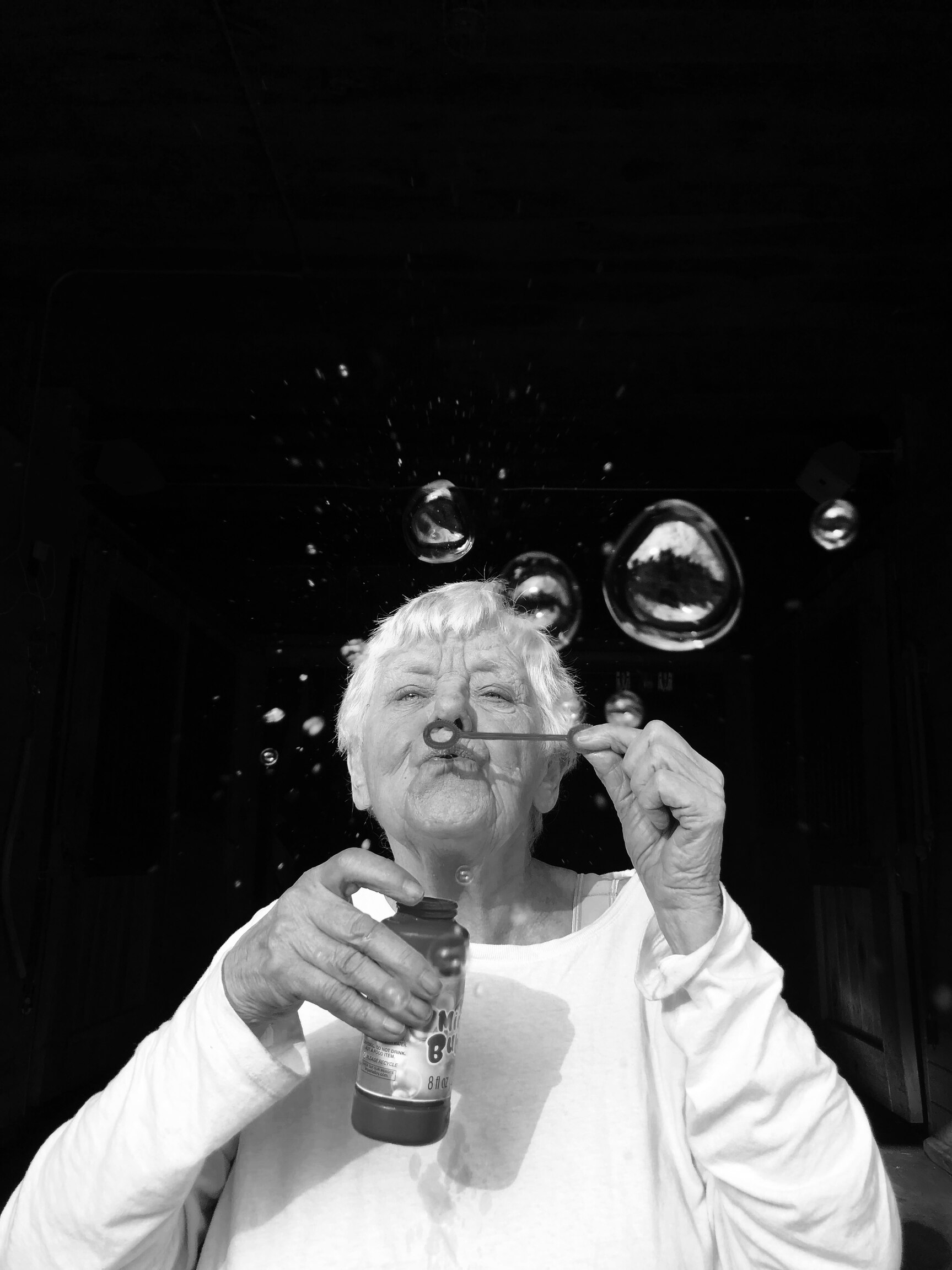 A woman blowing bubbles