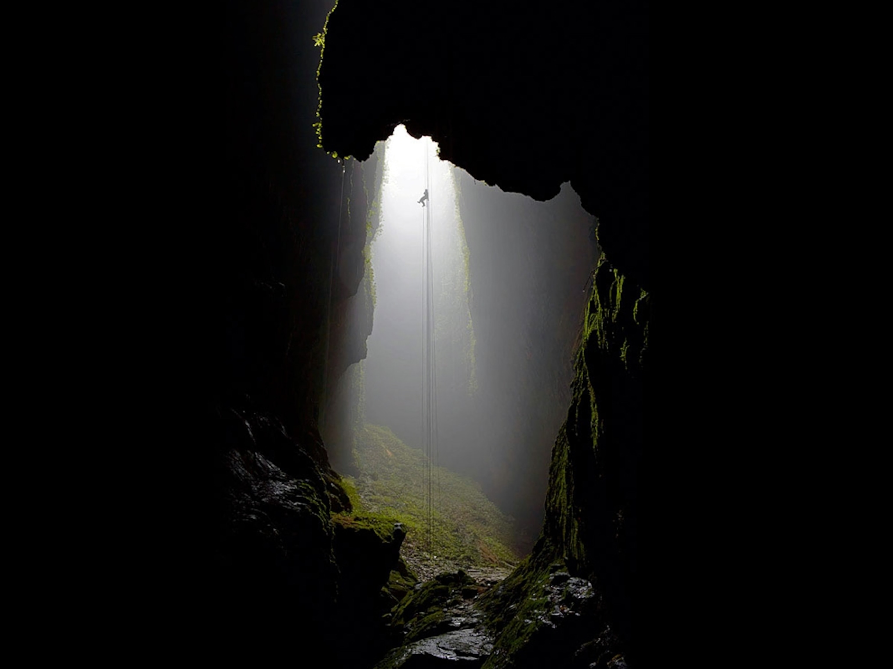 a person rappeling at Waitomo Caves, New Zealand