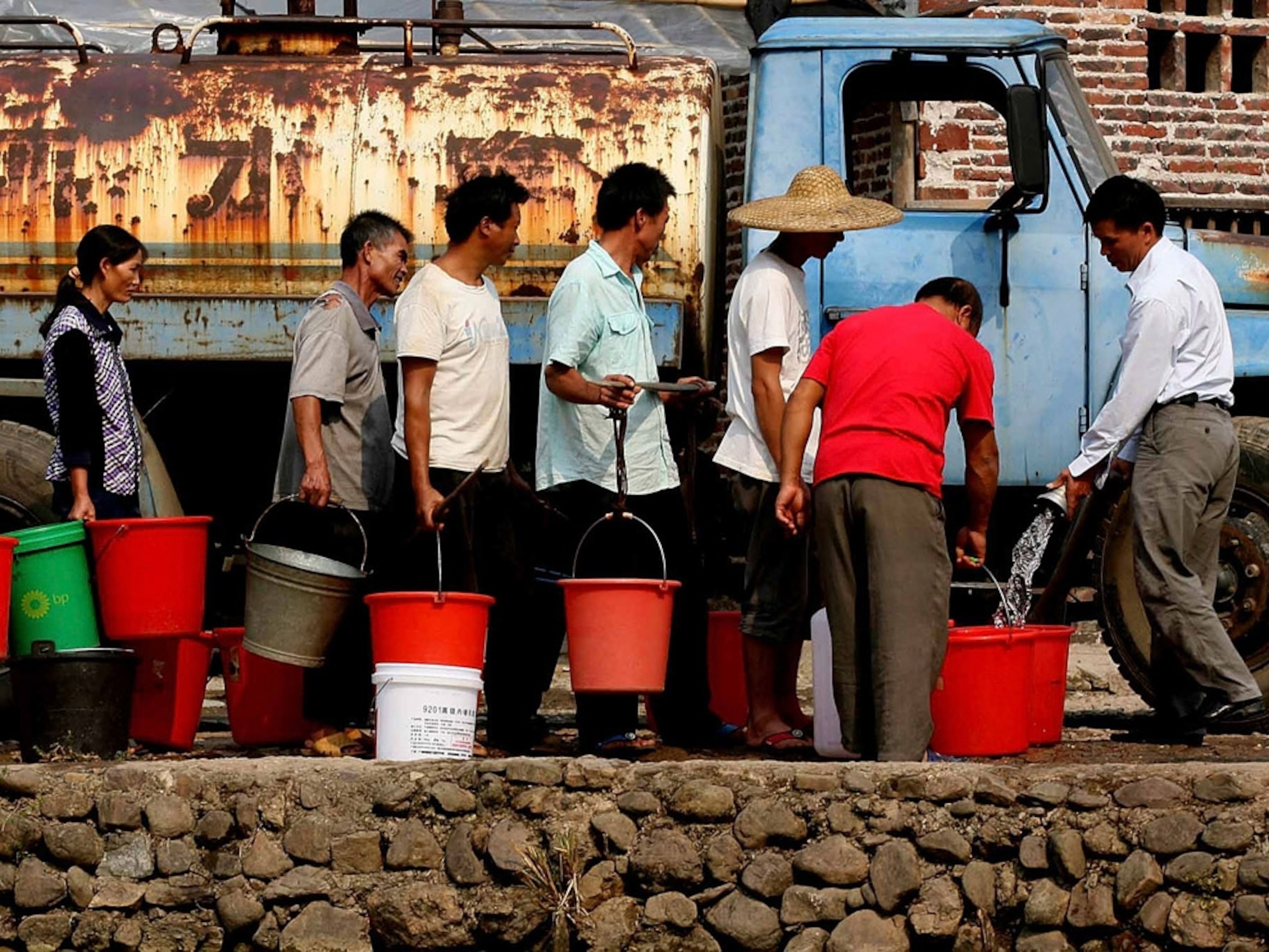 People wait in line for water in China