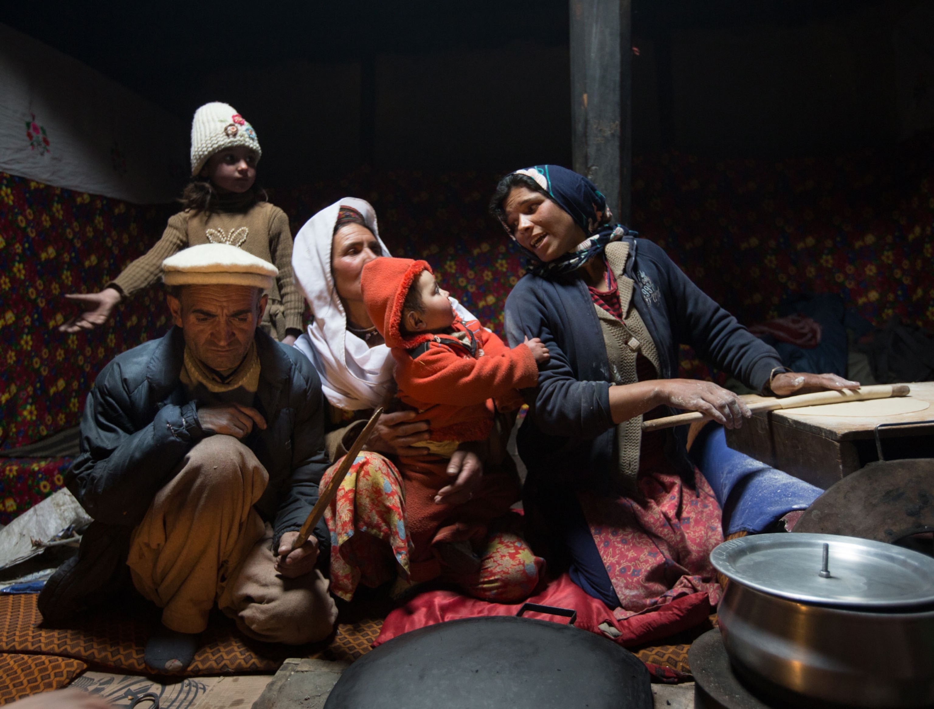 family in kitchen in Pakistan