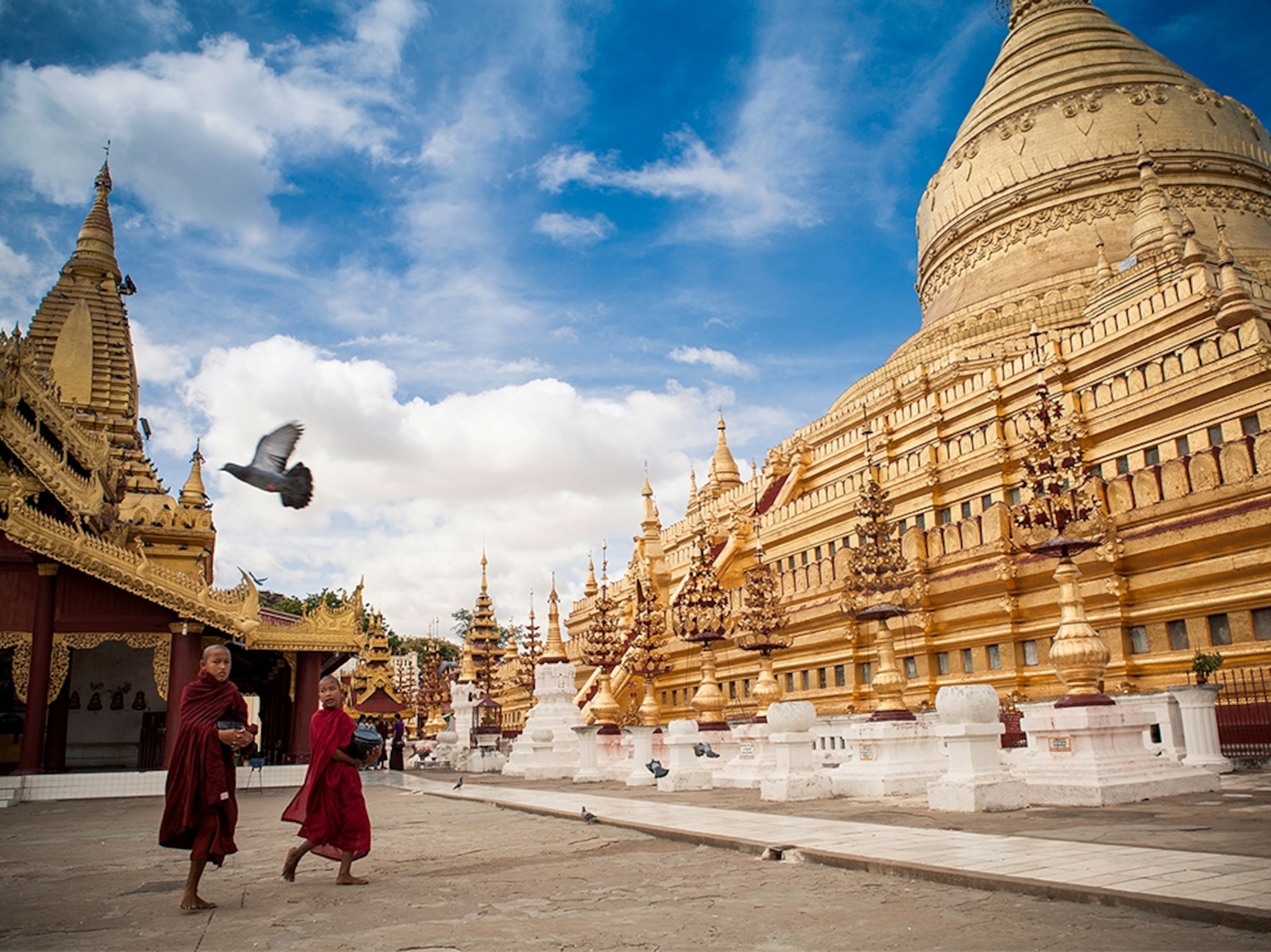 monks outside a pagoda in Bagan, Burma