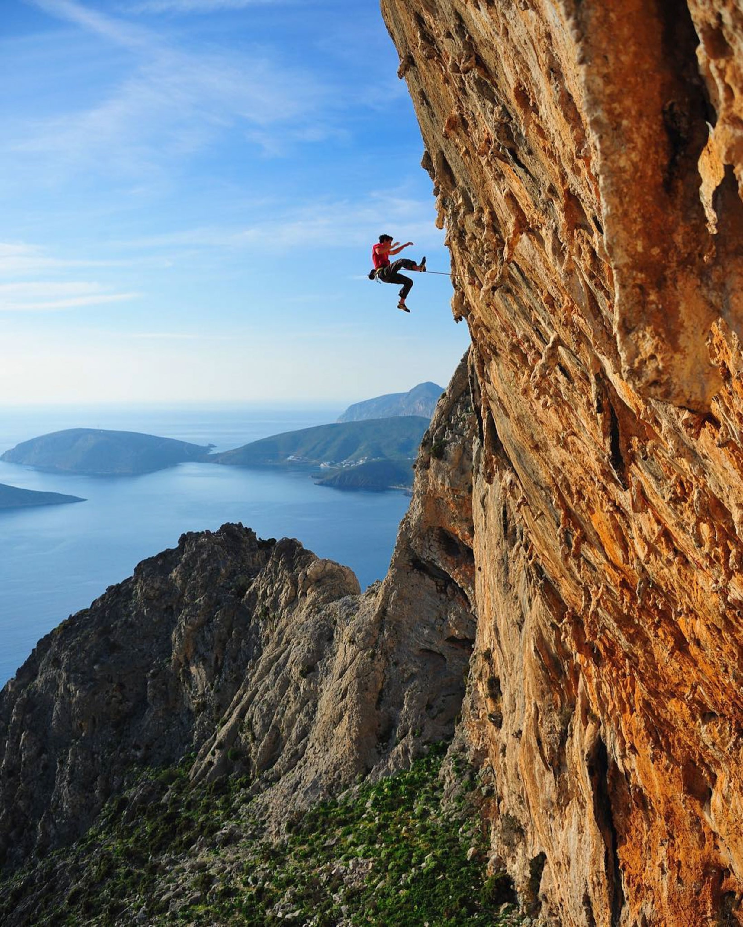 a climber falling off a limestone cliff in Greece