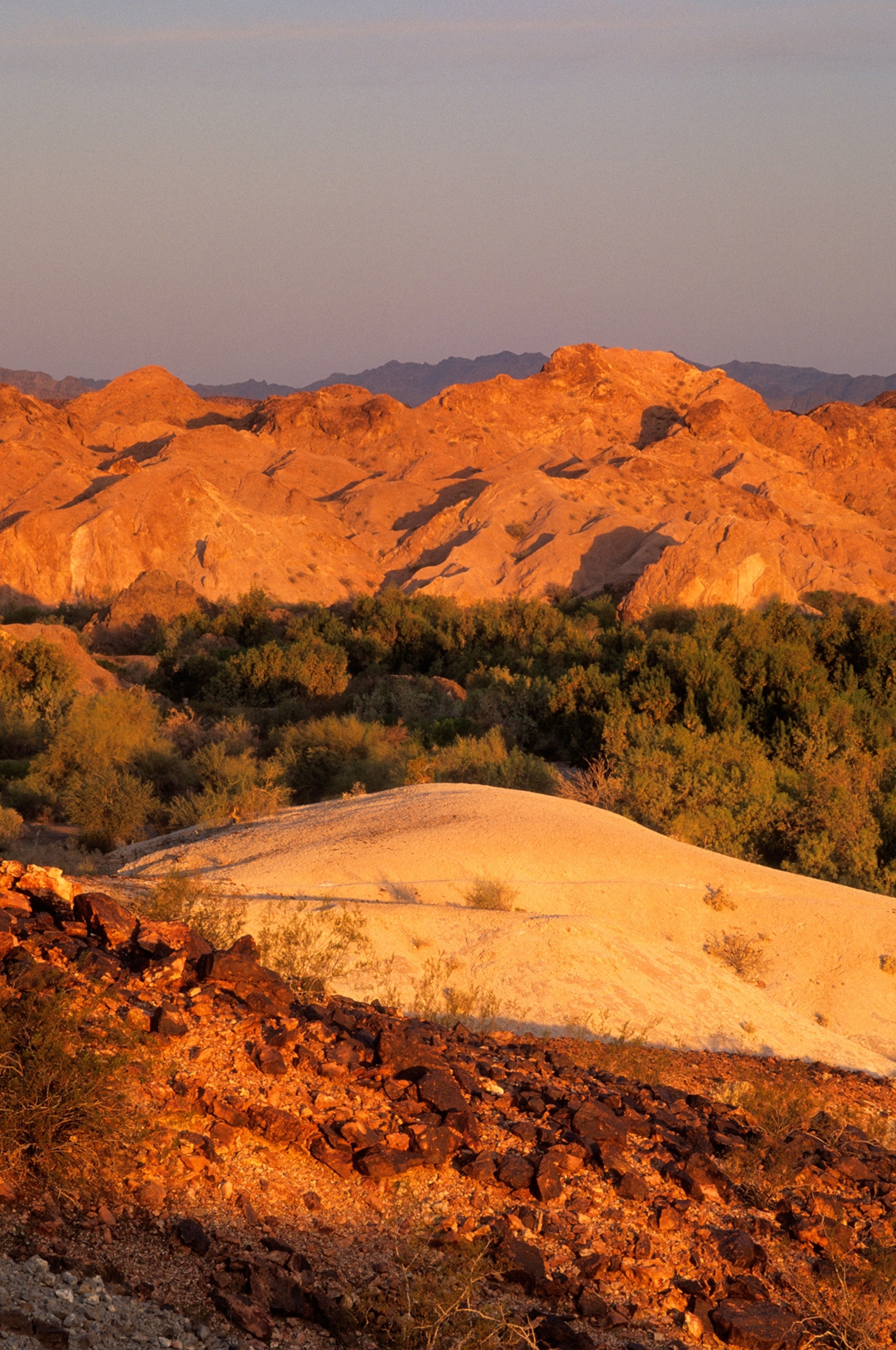 Sunrise colors the eroded hills at Picacho State Recreation Area in the California Desert, USA