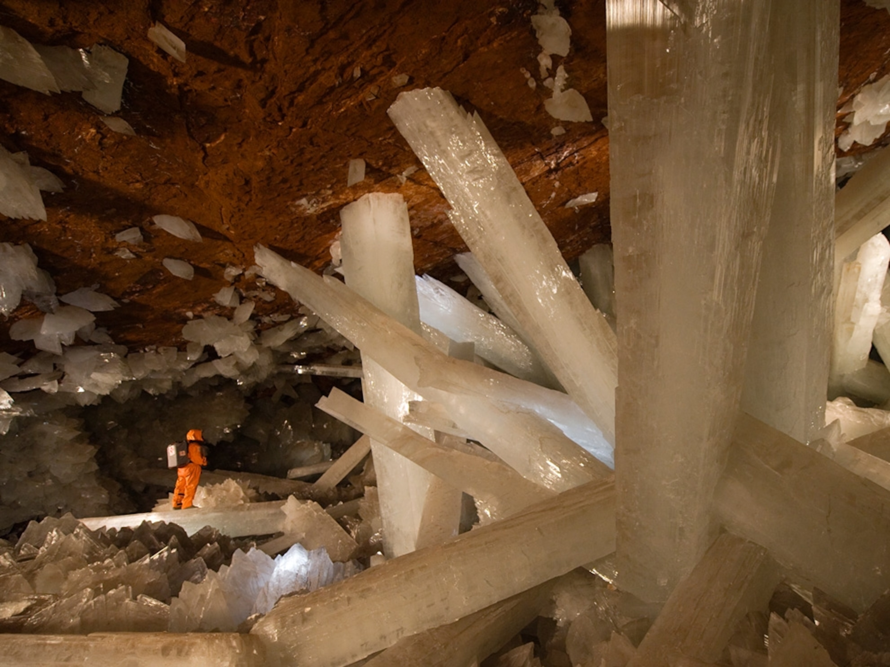 A cave explorer in Mexico views massive selenite crystals