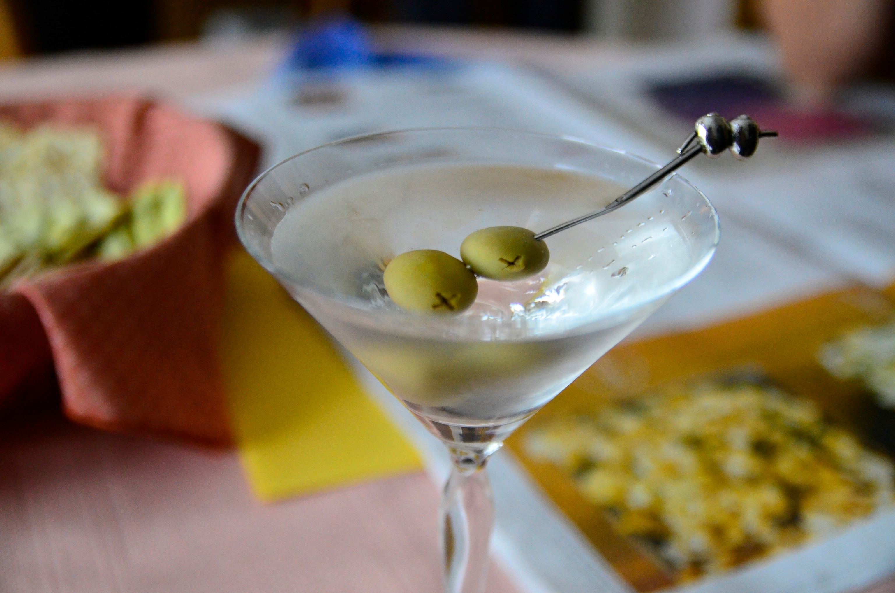 a perfect martini, straight up with two olives