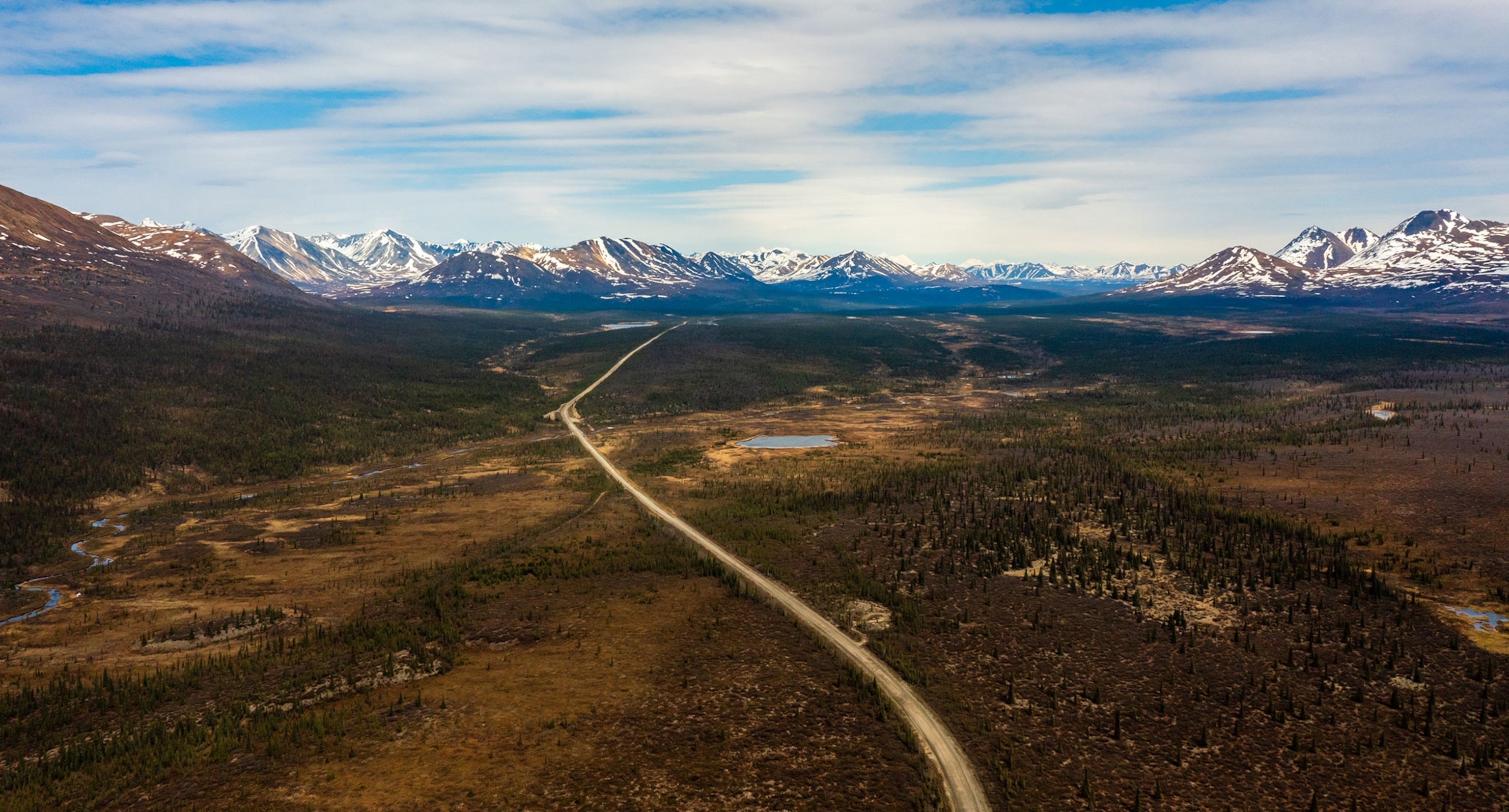 A path can be seen cutting through the landscape into the distance.