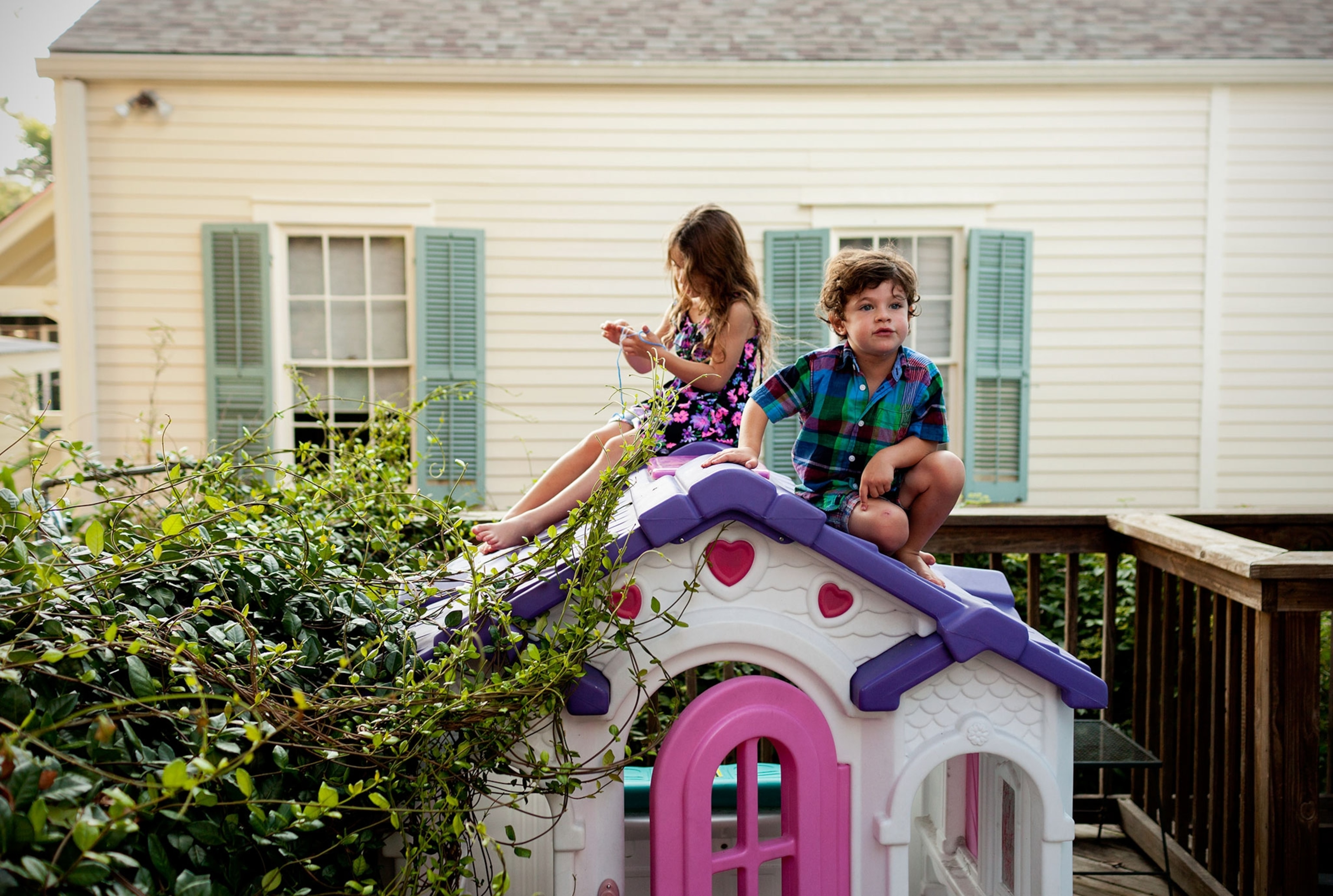 children playing on a toy house