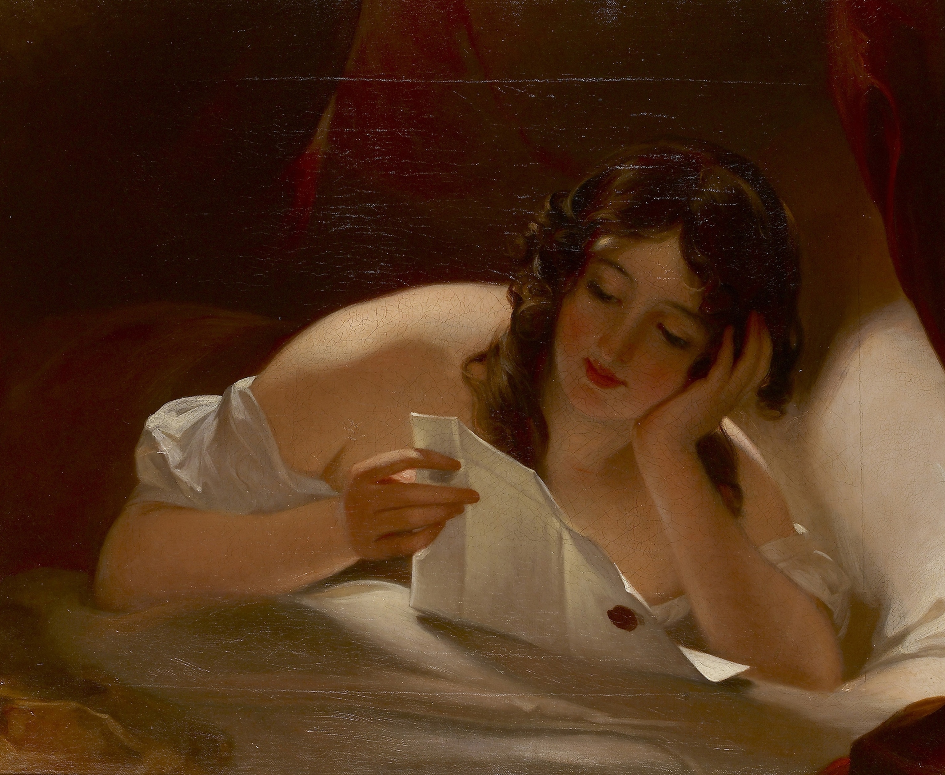 A women reads a love letter.