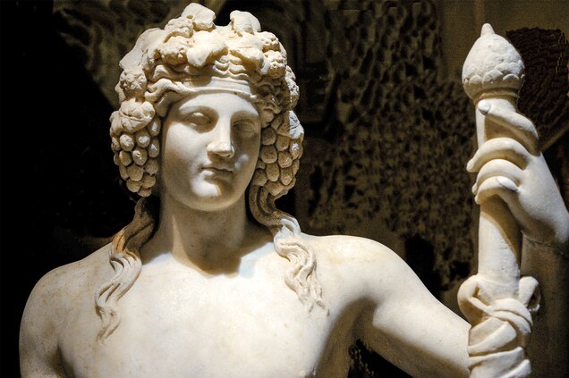 A youthful Dionysus is crowned with grapes in a first-century A.D. marble statue at the Naples Archaeological Museum.