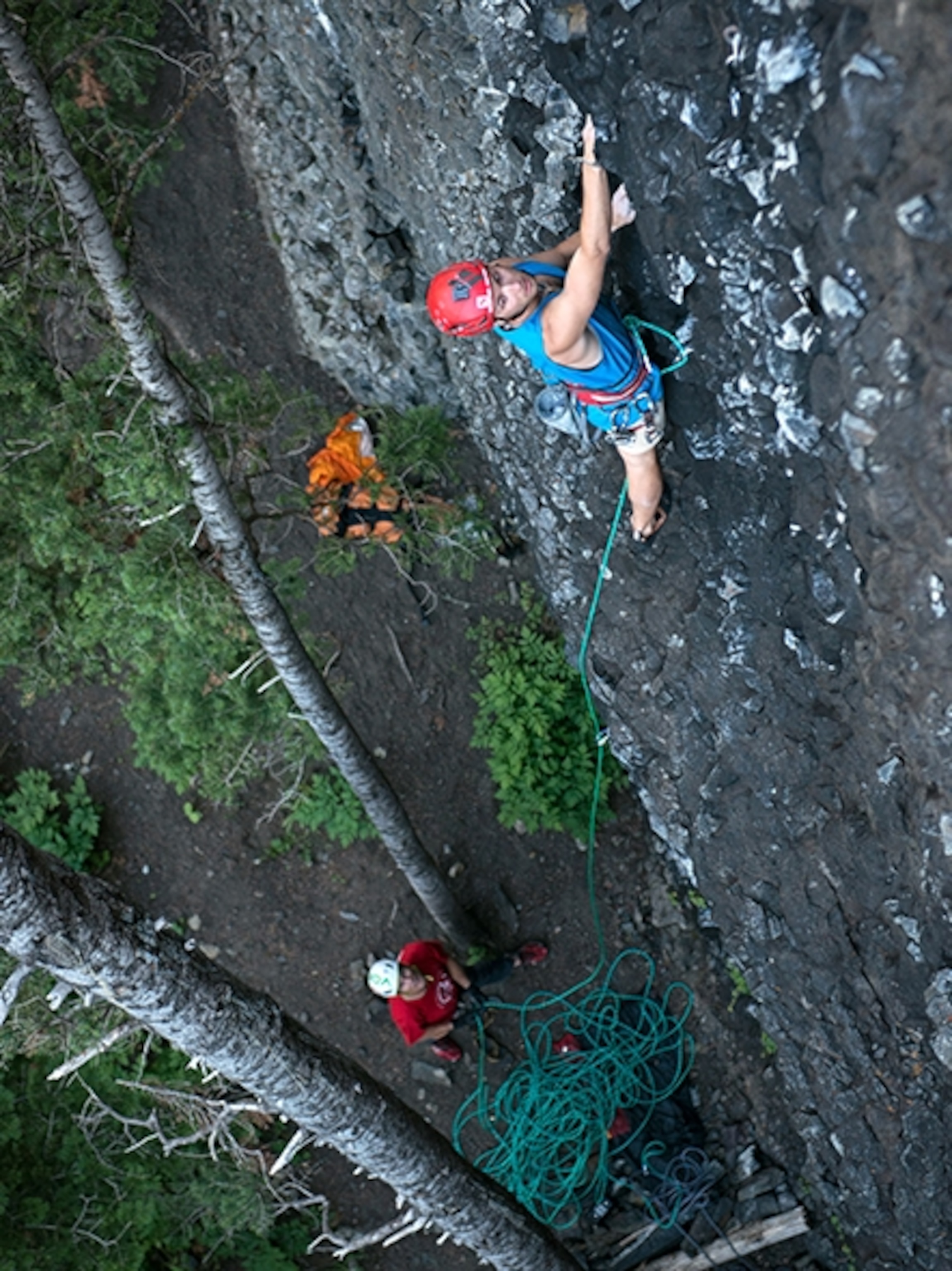 Brody Leven leads a route on the Magic Wall as Conrad belays, Hyalite Canyon, Montana: Photograph by Max Lowe