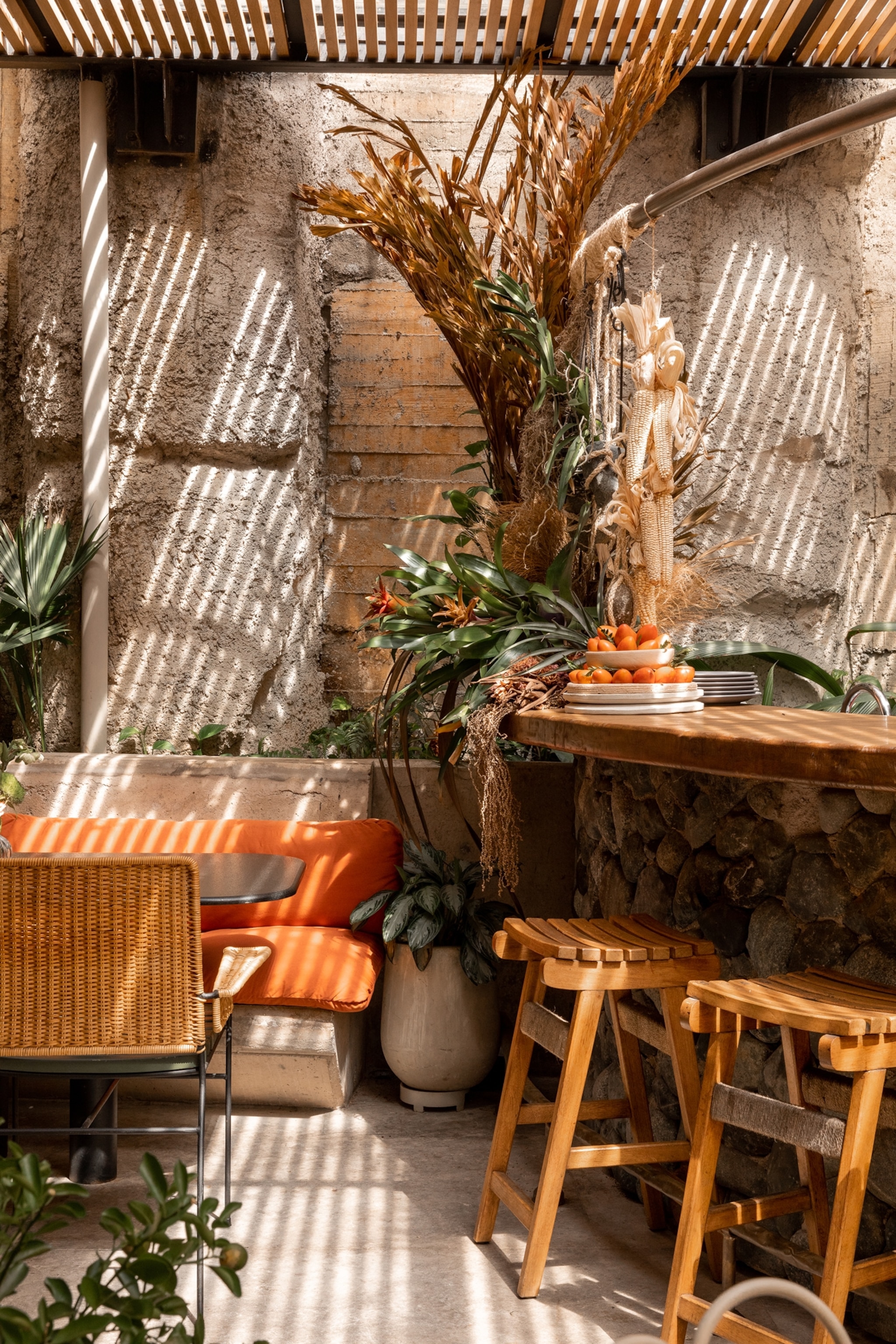 Cala Roca, the restaurant at 23 Hotel, where tropical light and greenery shape the dining space.