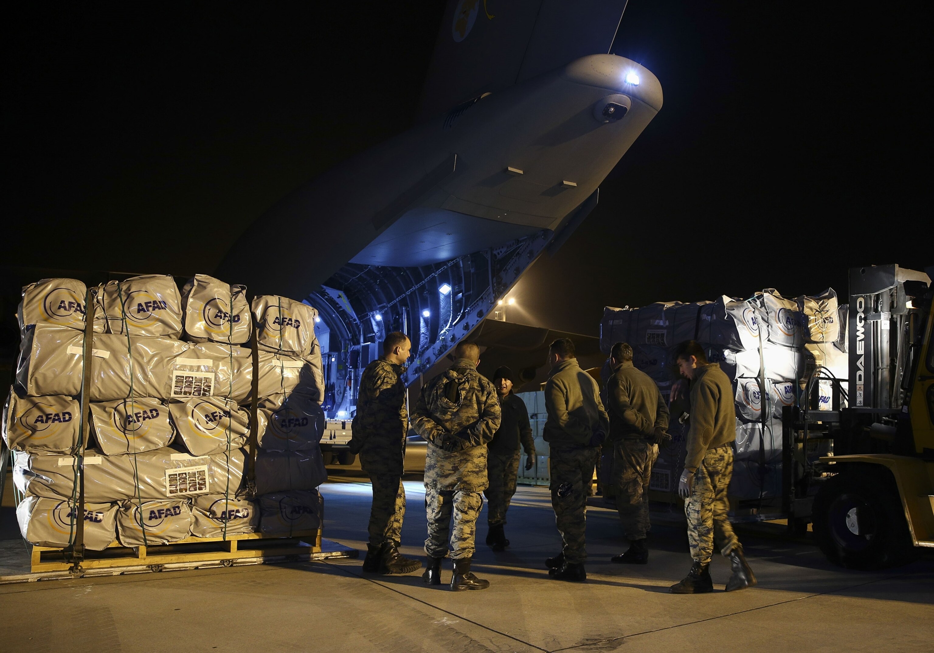 aid supplies being loaded on to a cargo plane