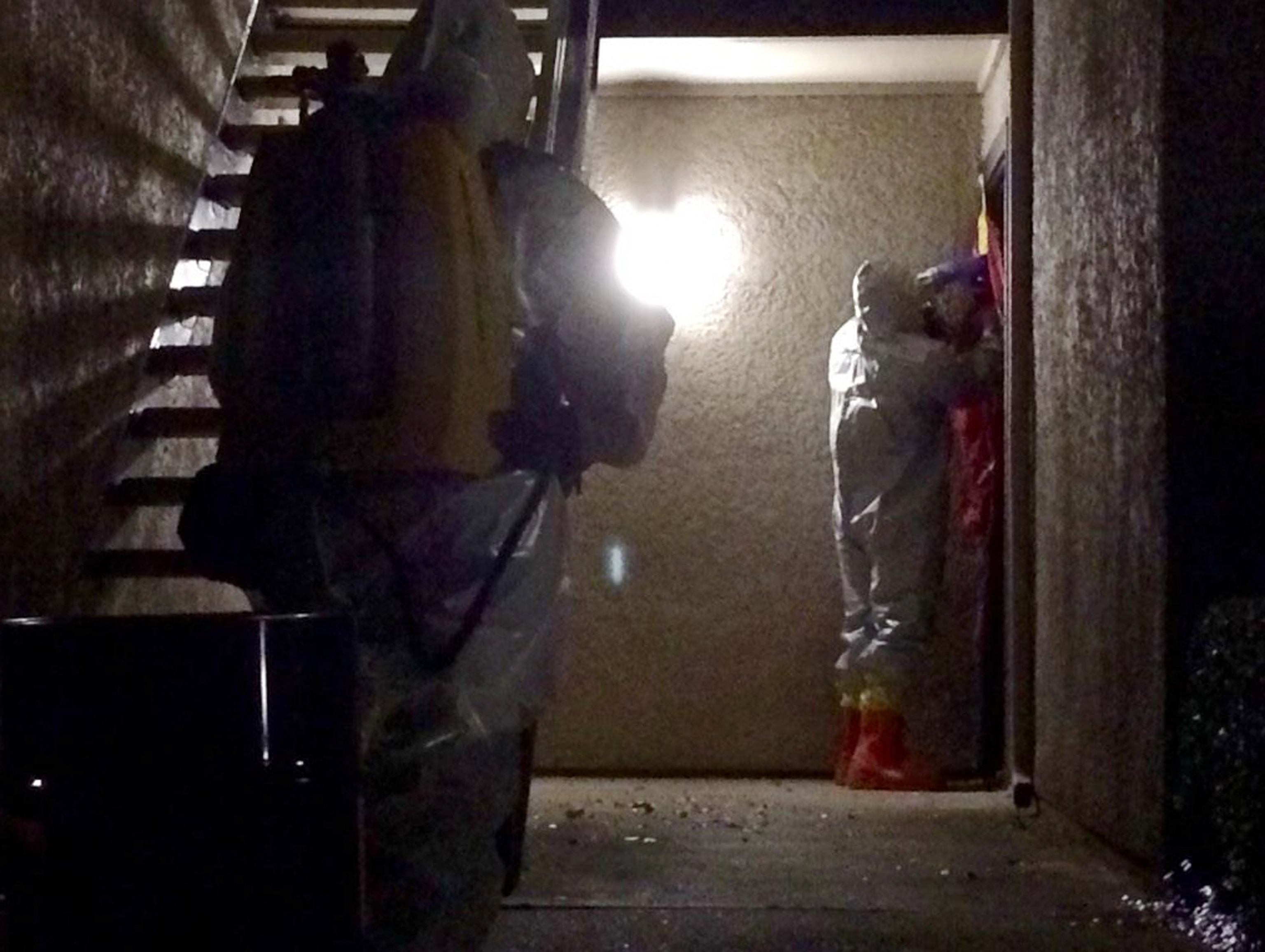 health workers taping the door of healthcare worker in Dallas.