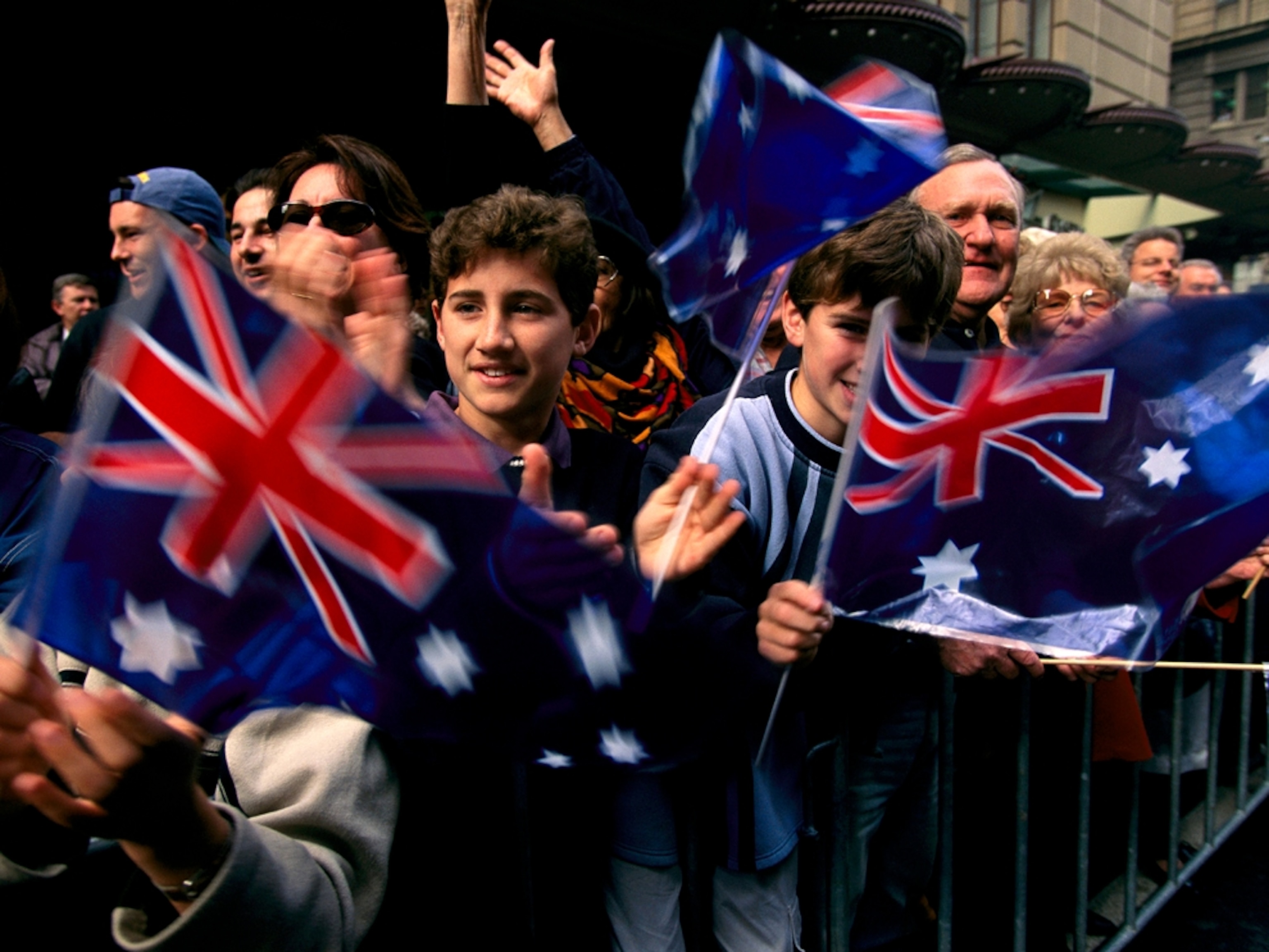 Crowd cheering a parade