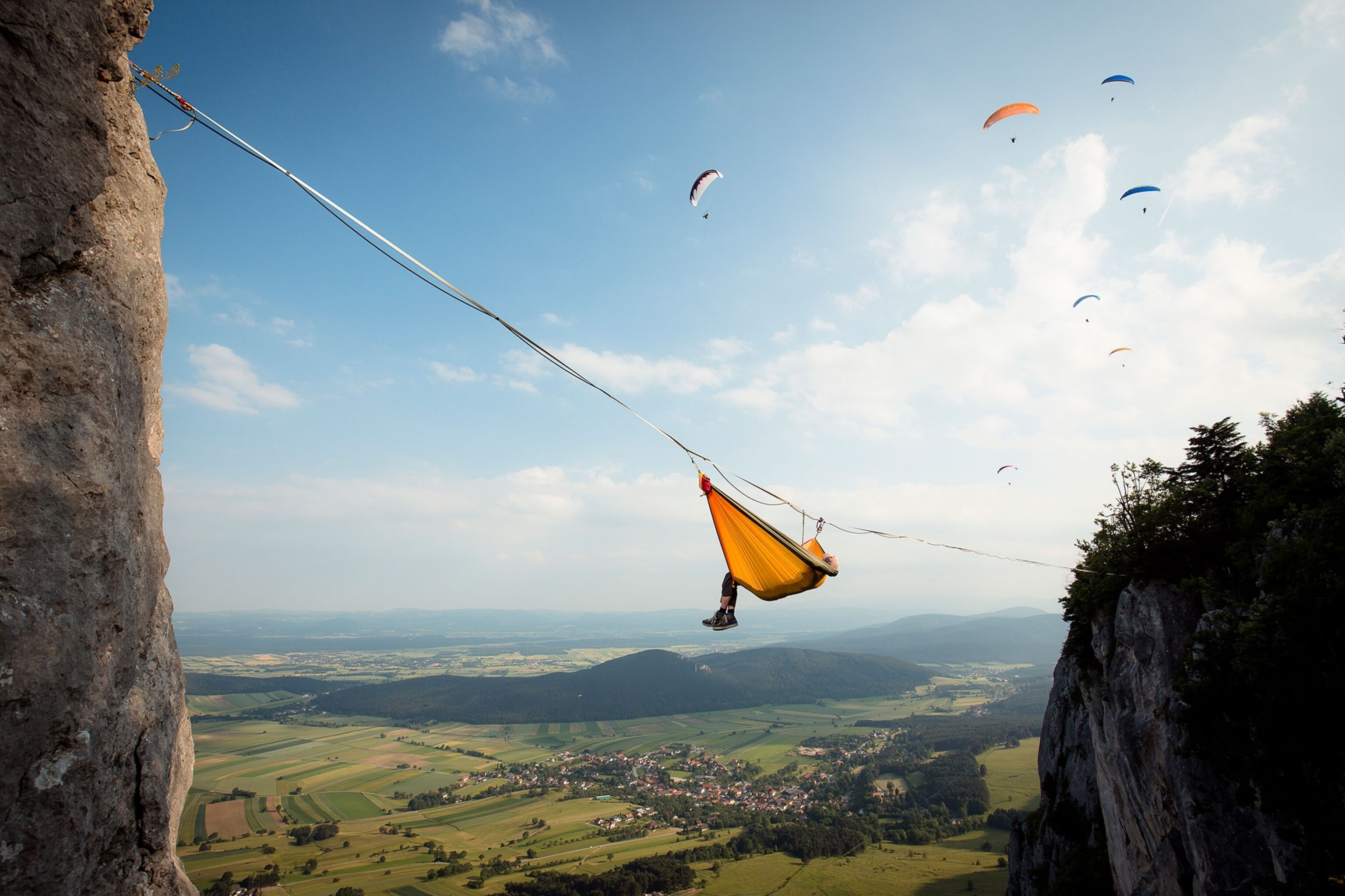 of a highline athlete hanging in a hammock in Austria