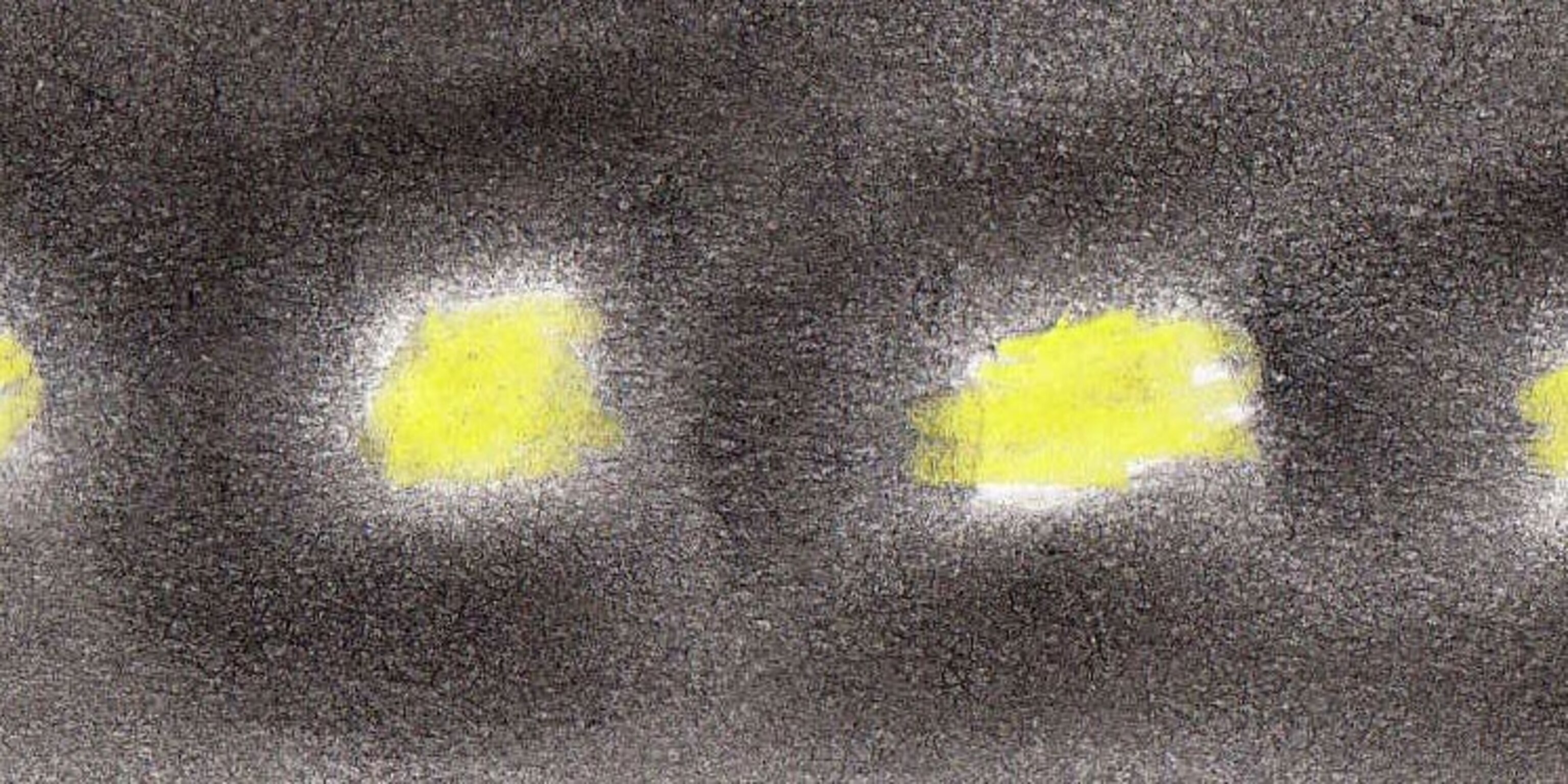 Drawing of a black blog with four little yellow spots in a straight line