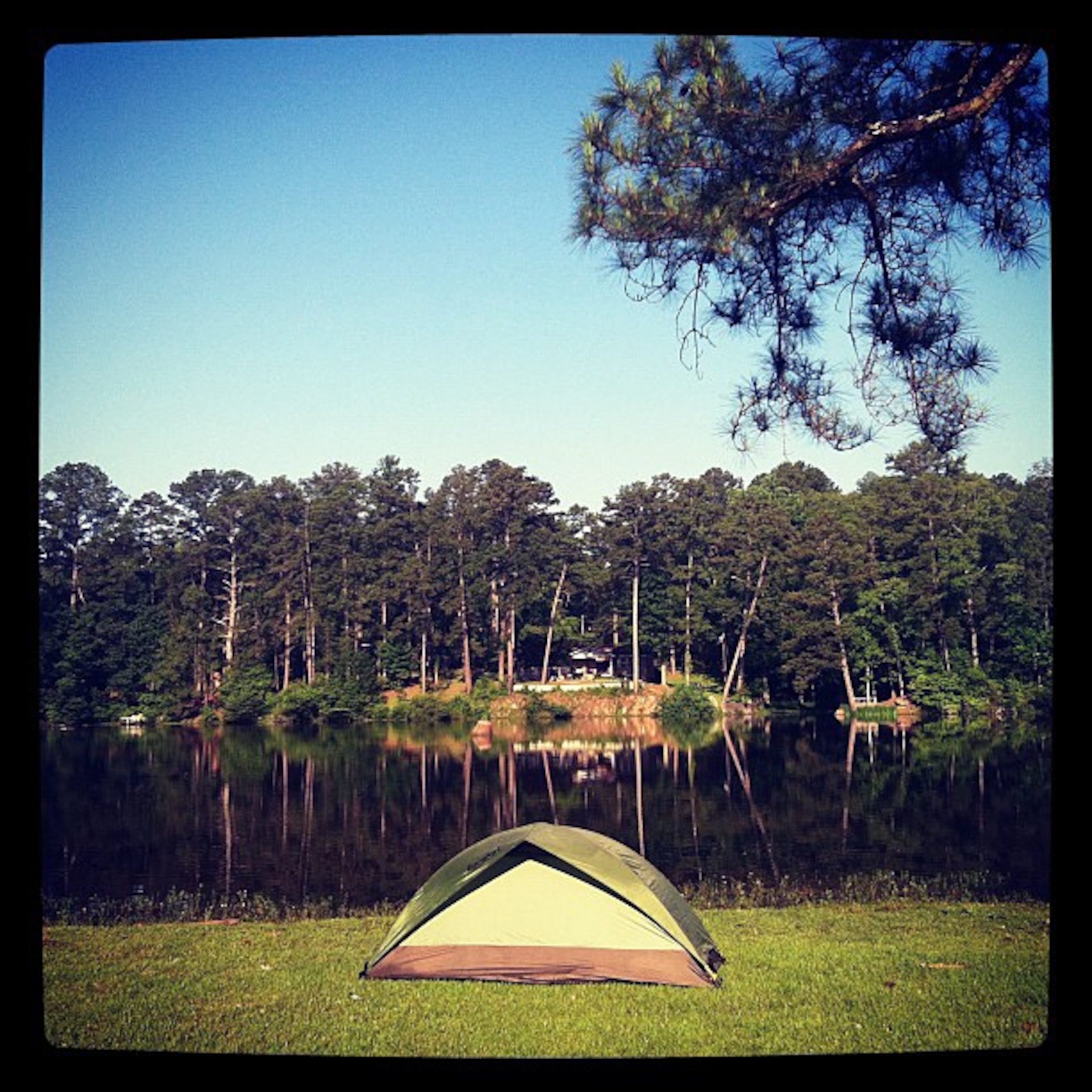 Instagram shot of camping tent alongside river