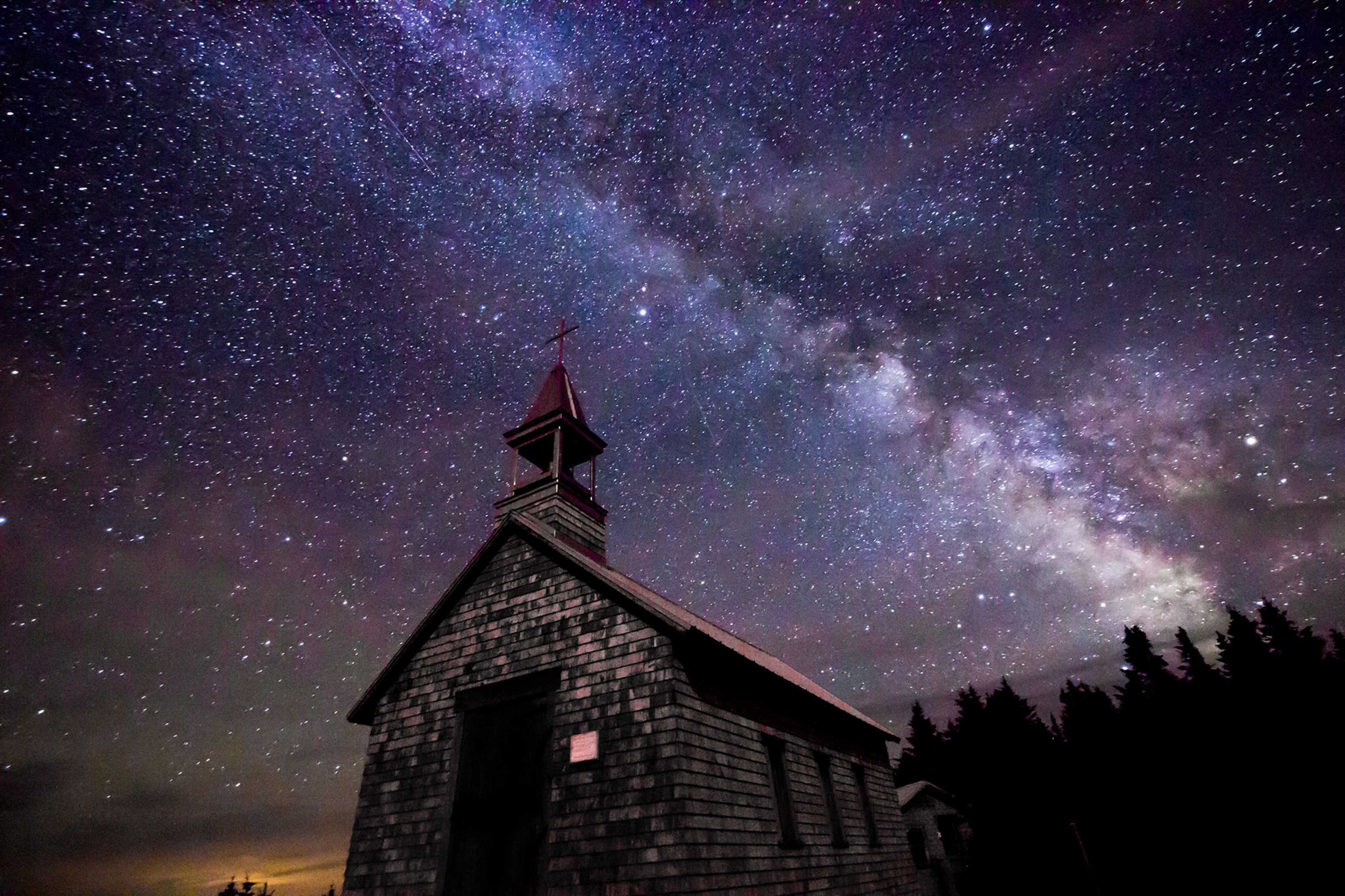 A building photographed from below under the stars.