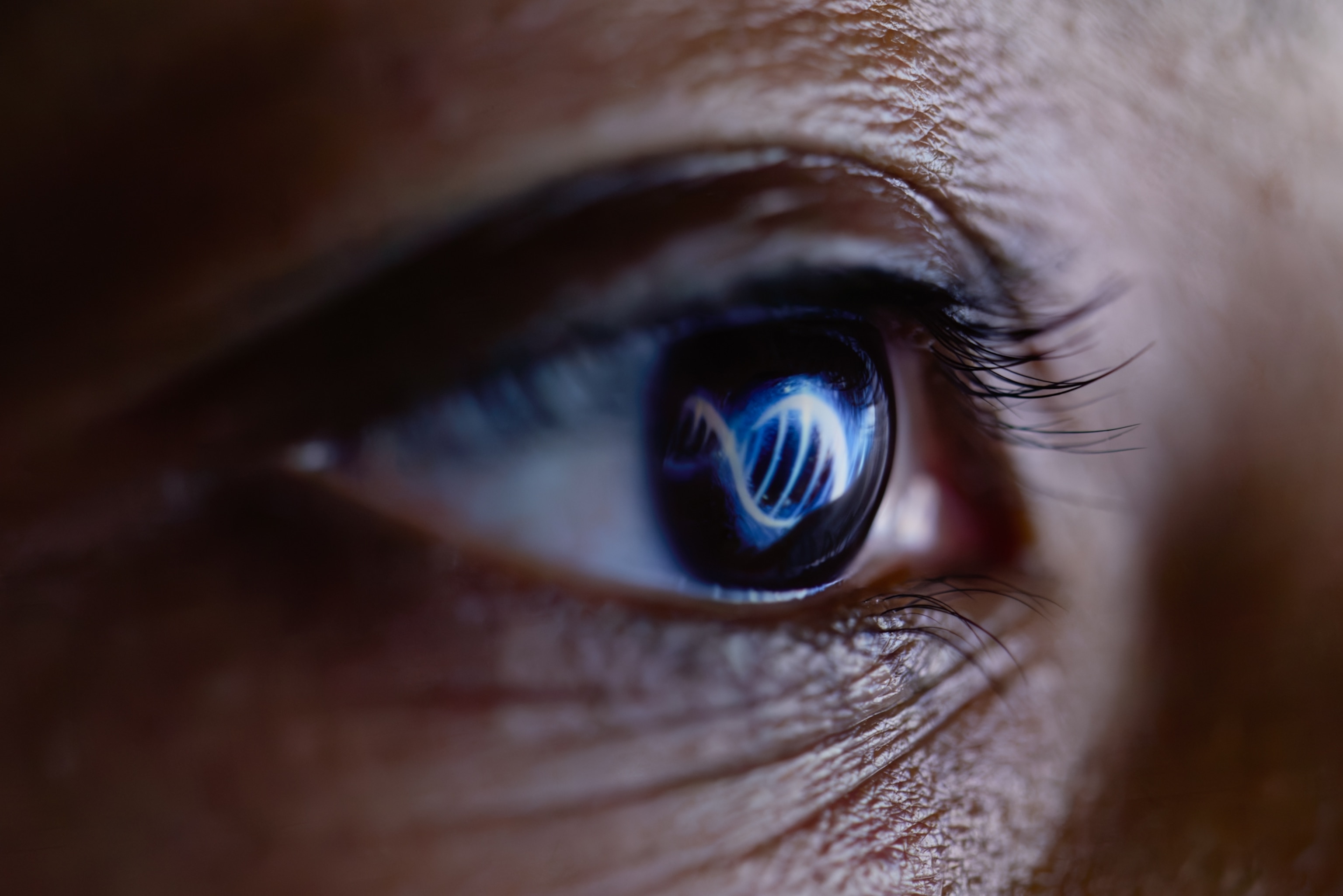 A close-up view of a human eye, which is reflecting a double-helix DNA structure