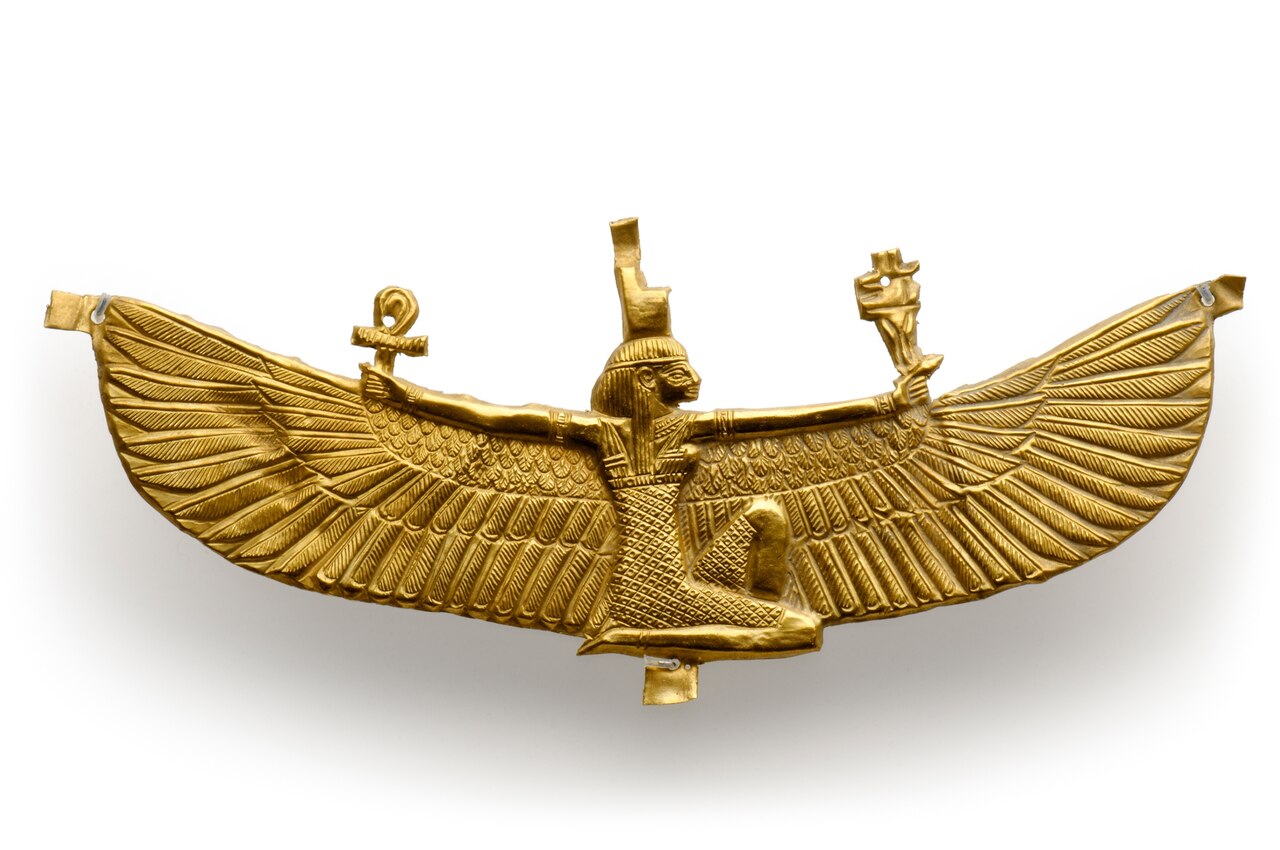 Picture of golden figure of woman with wide-spread wings.
