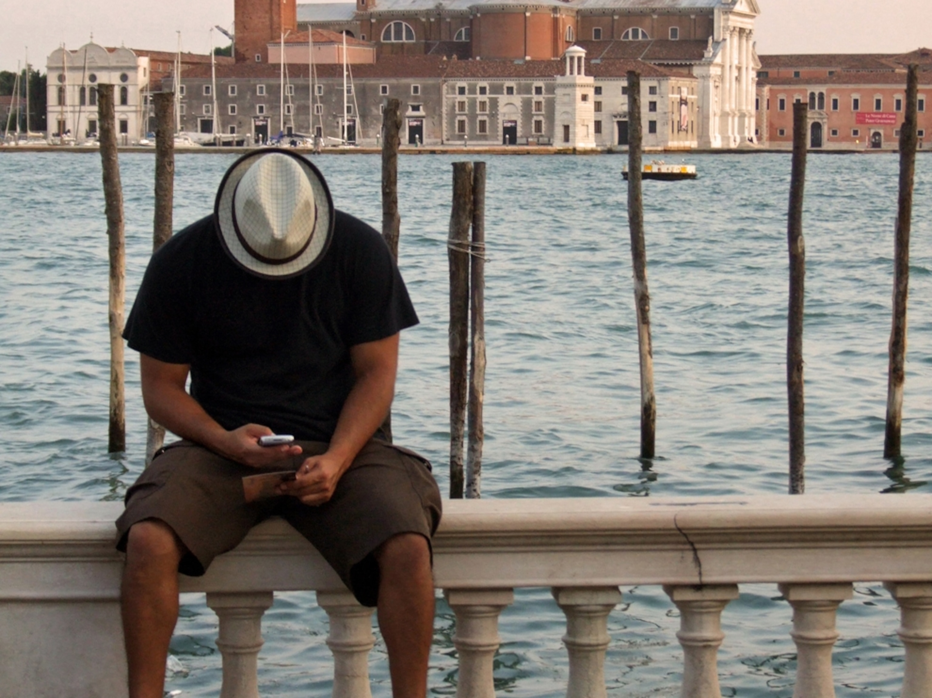 Man on cell phone in Venice