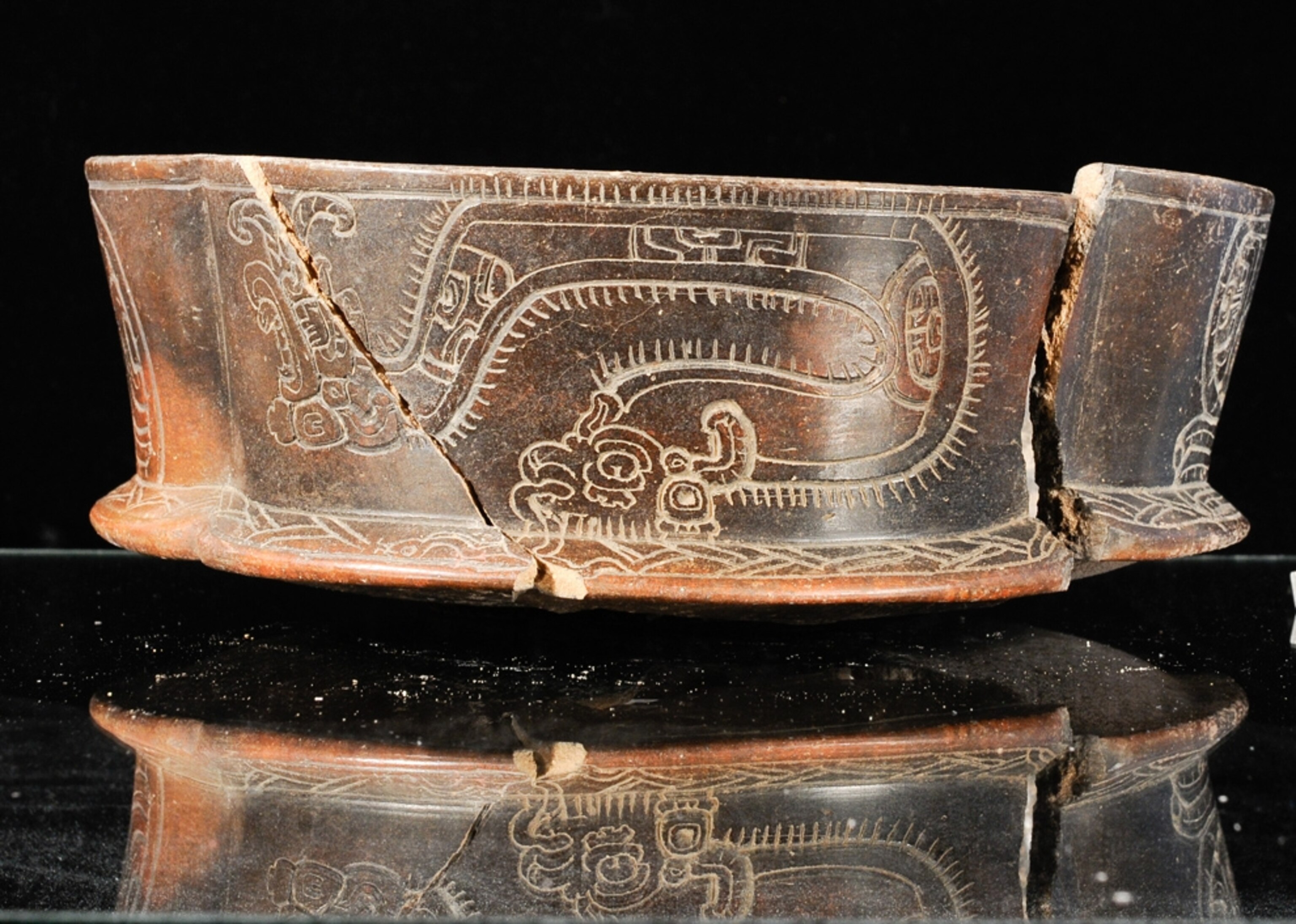 a millipede-etched bowl from the new Maya royal tomb in Guatemala noted for its bowls of human fingers.