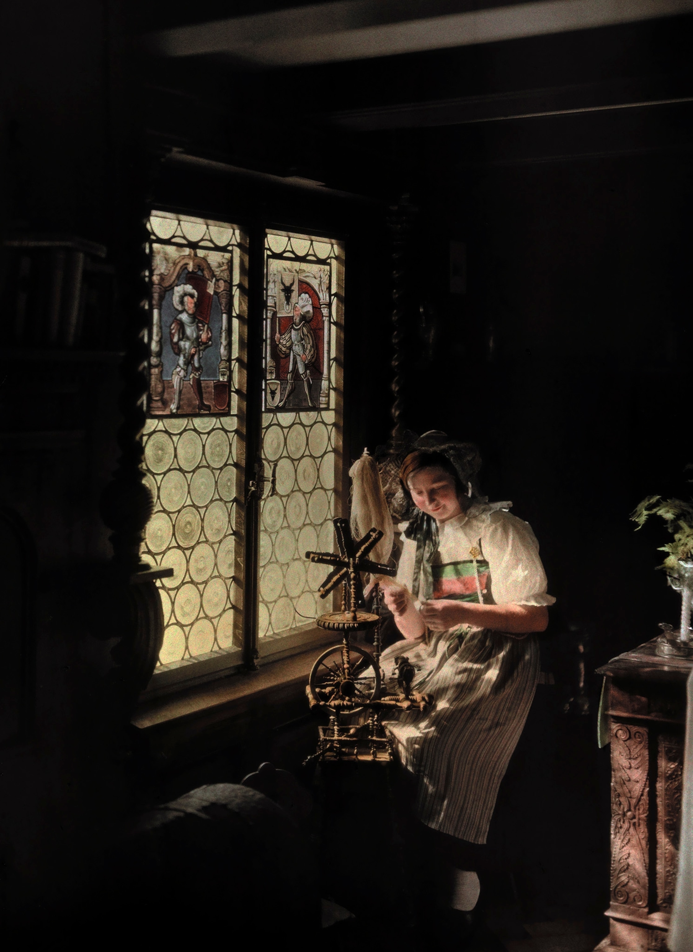 a woman working with her spinning wheel in Lucerne, Switzerland.