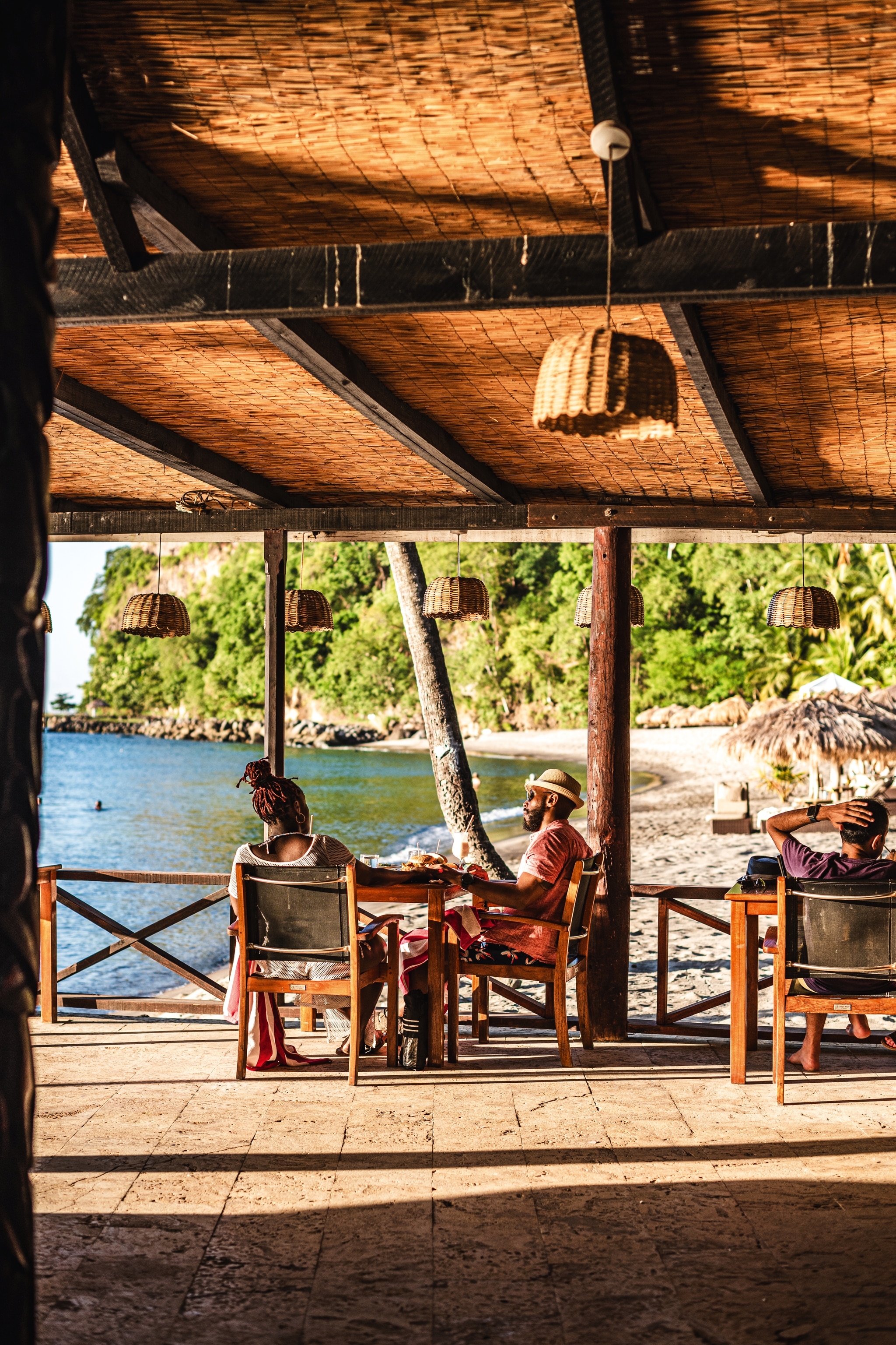 Couple sitting at beachfront Anse Chastanet