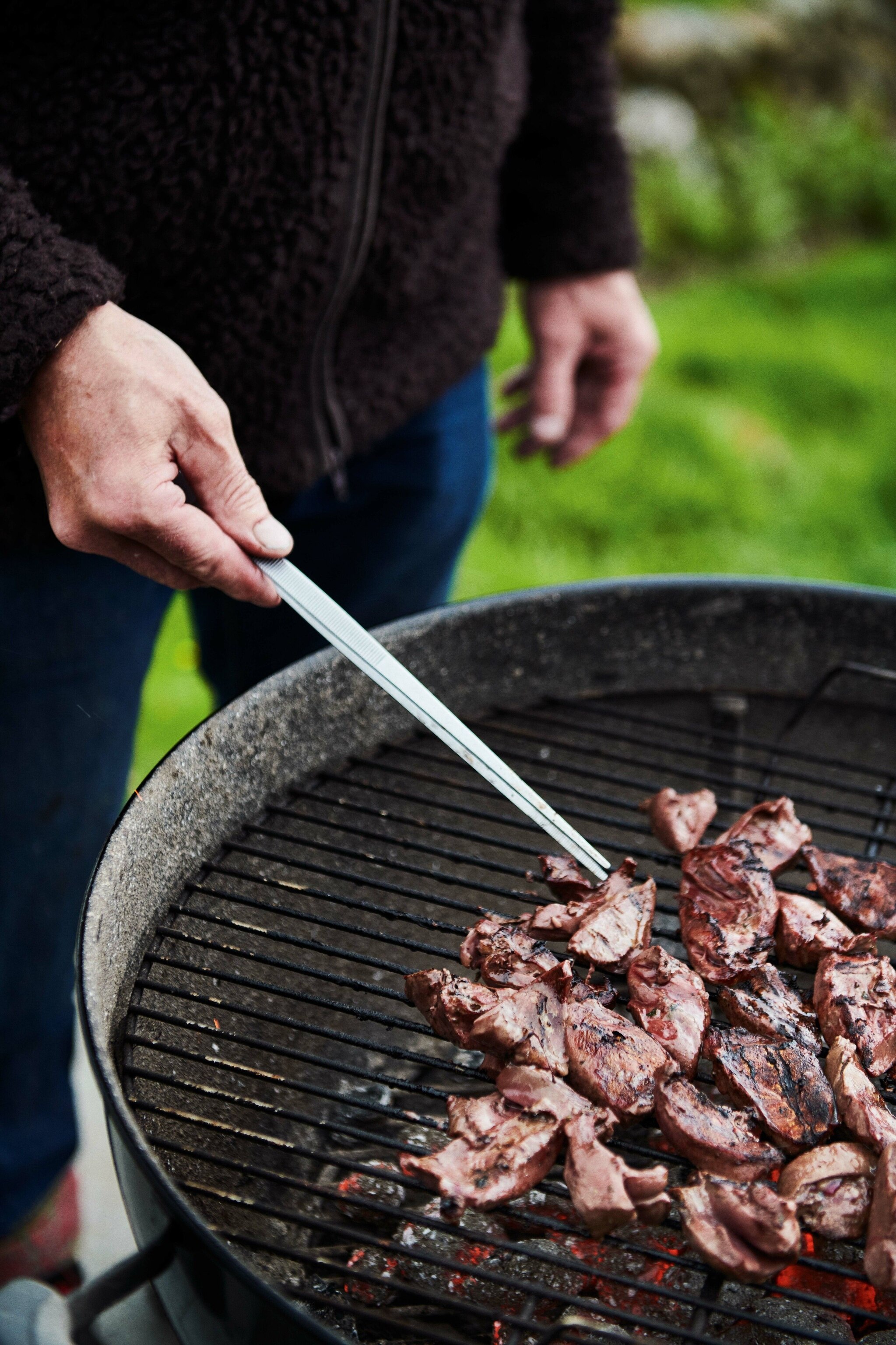 Anna and Marjun pick rhubarb in the fruit and veg patch.