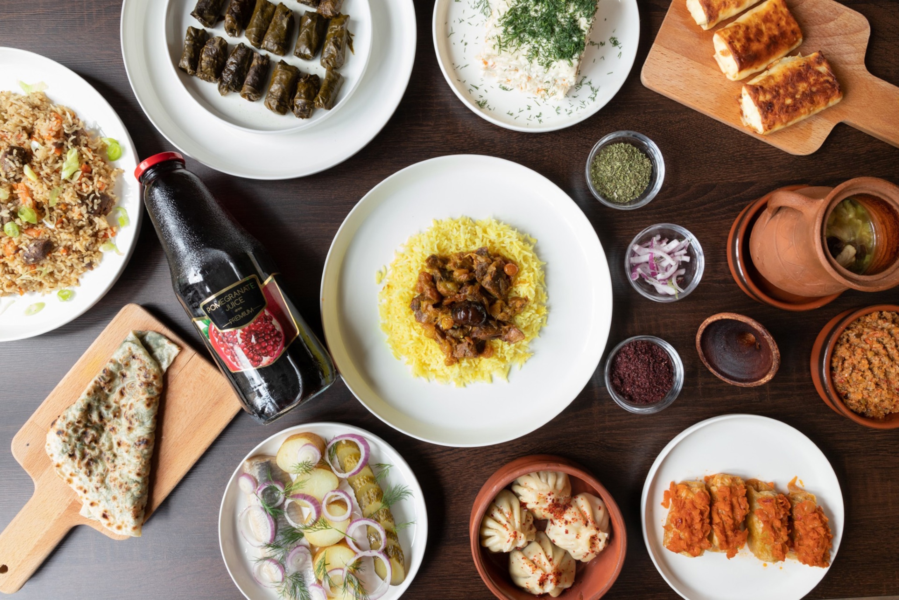 A generous spread of multiple dishes, including spiced rice and meat dishes.