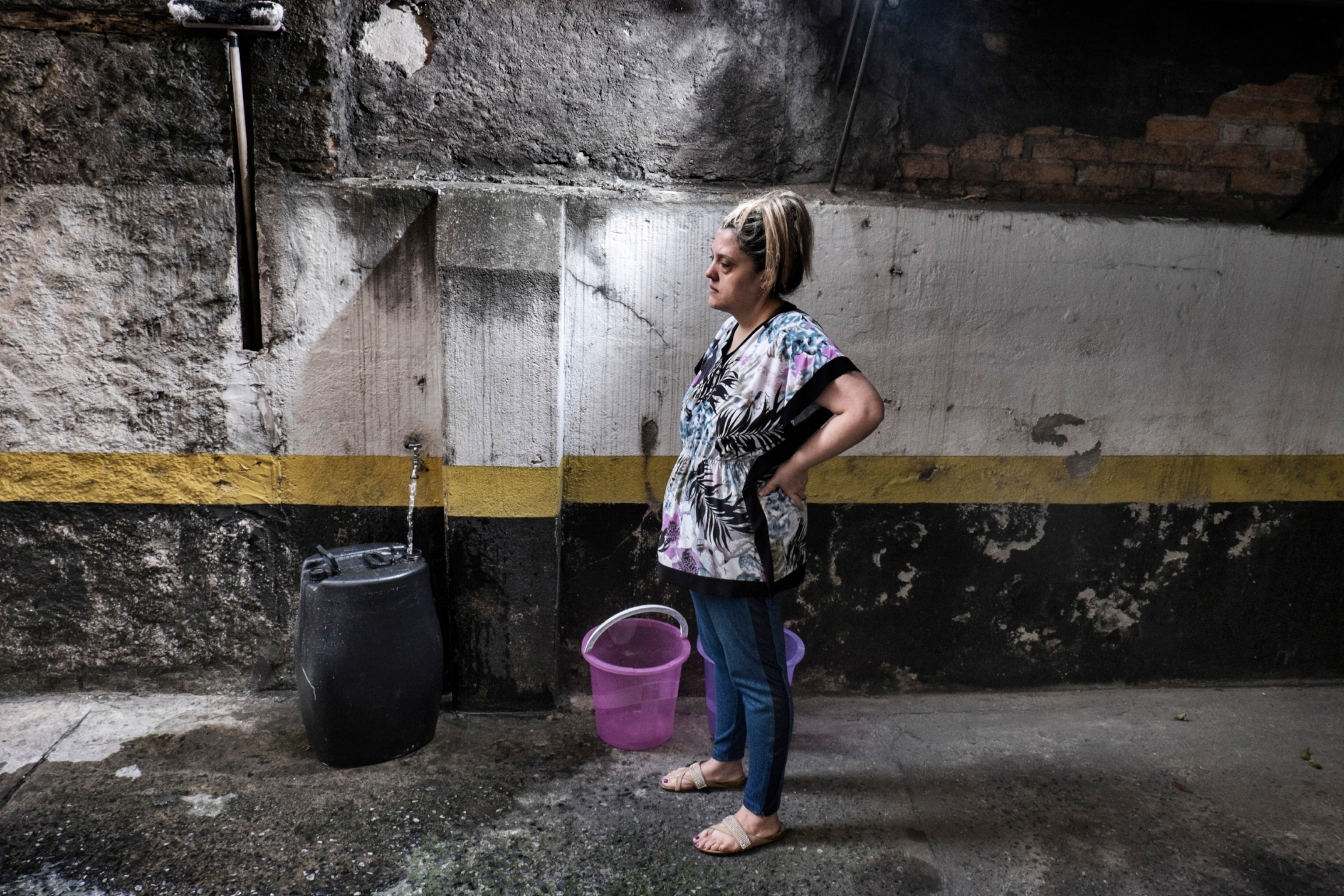 a woman with a pail for water