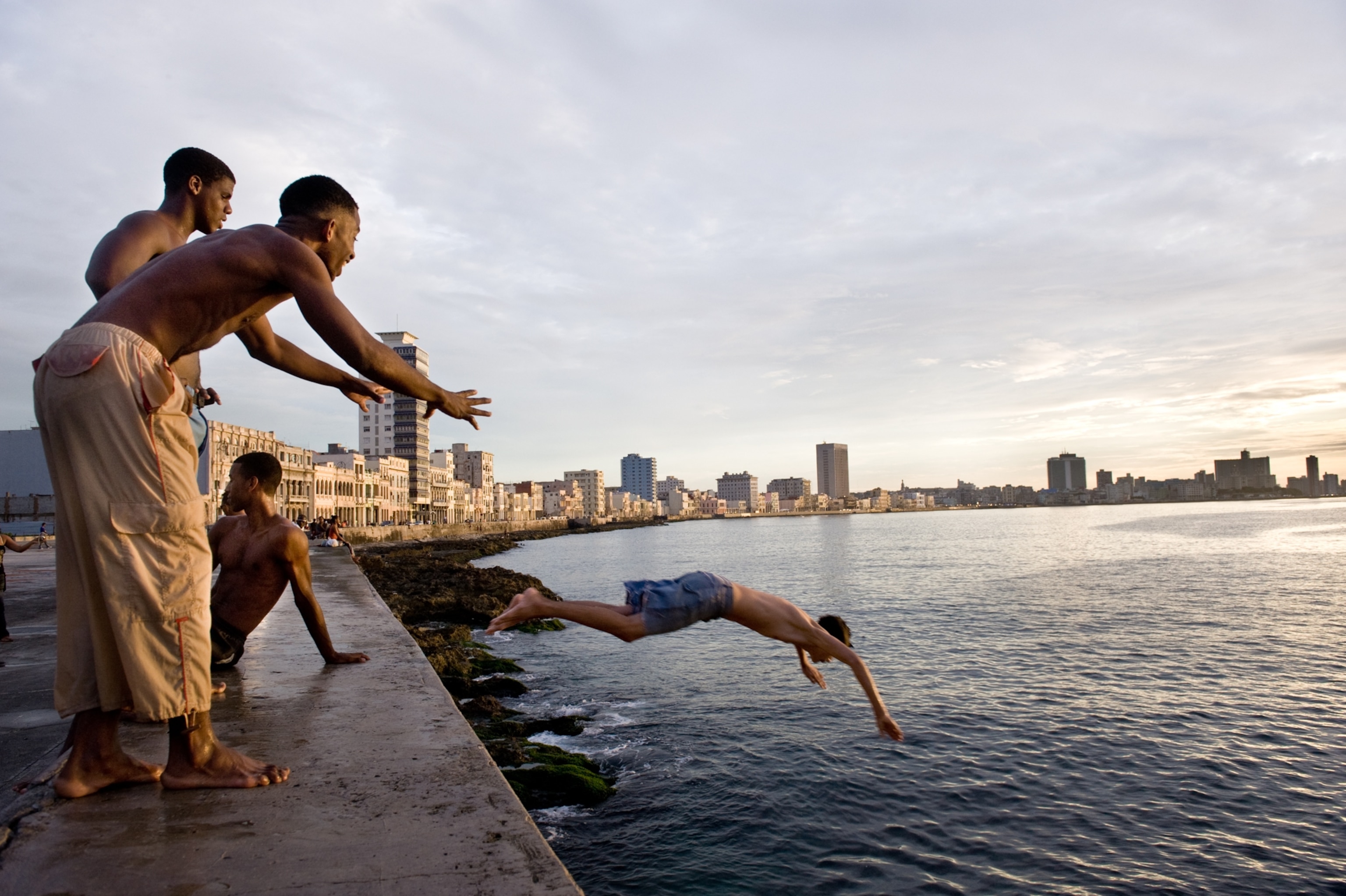 boys playing by the ocean in Havana, Cuba