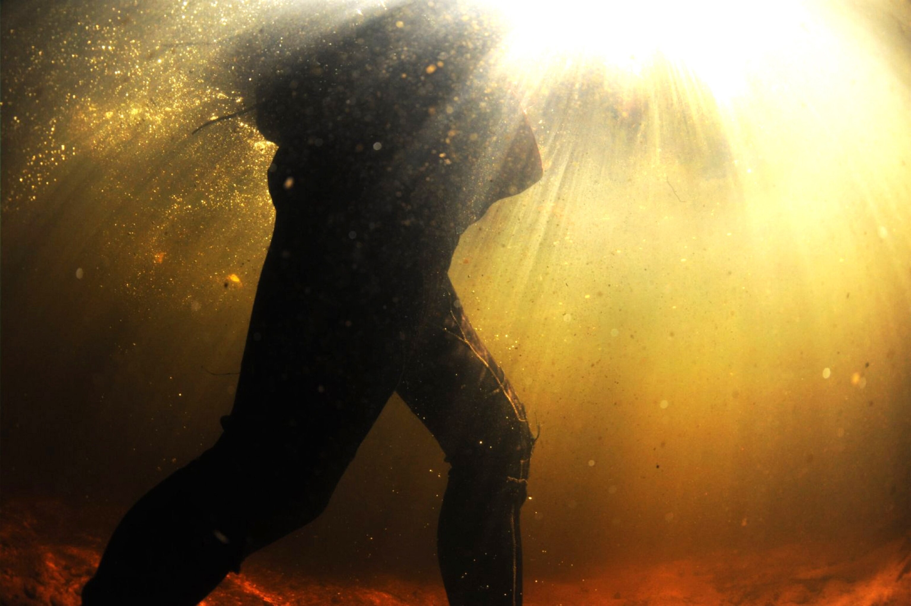 a canyoneer chest deep in water in Rocky Creek Canyon