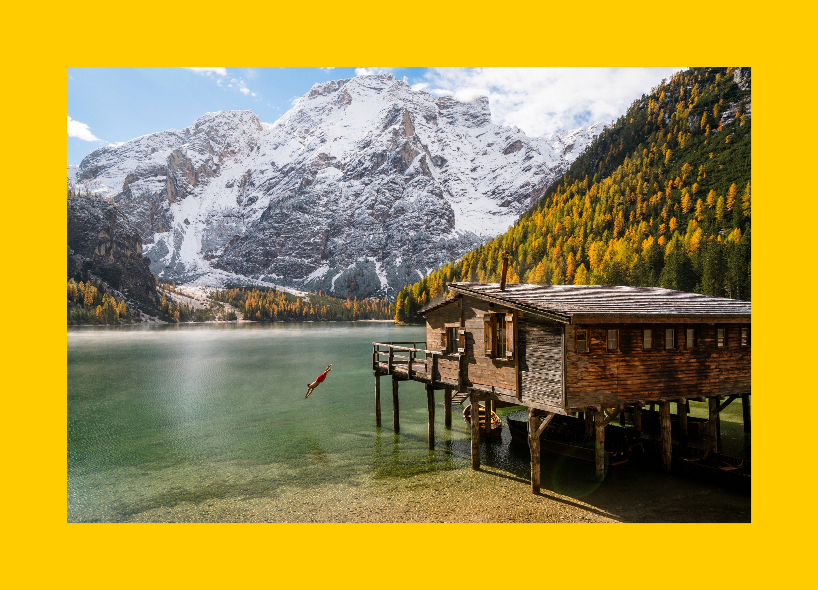 A person dives into the scenic Lago di Braies 