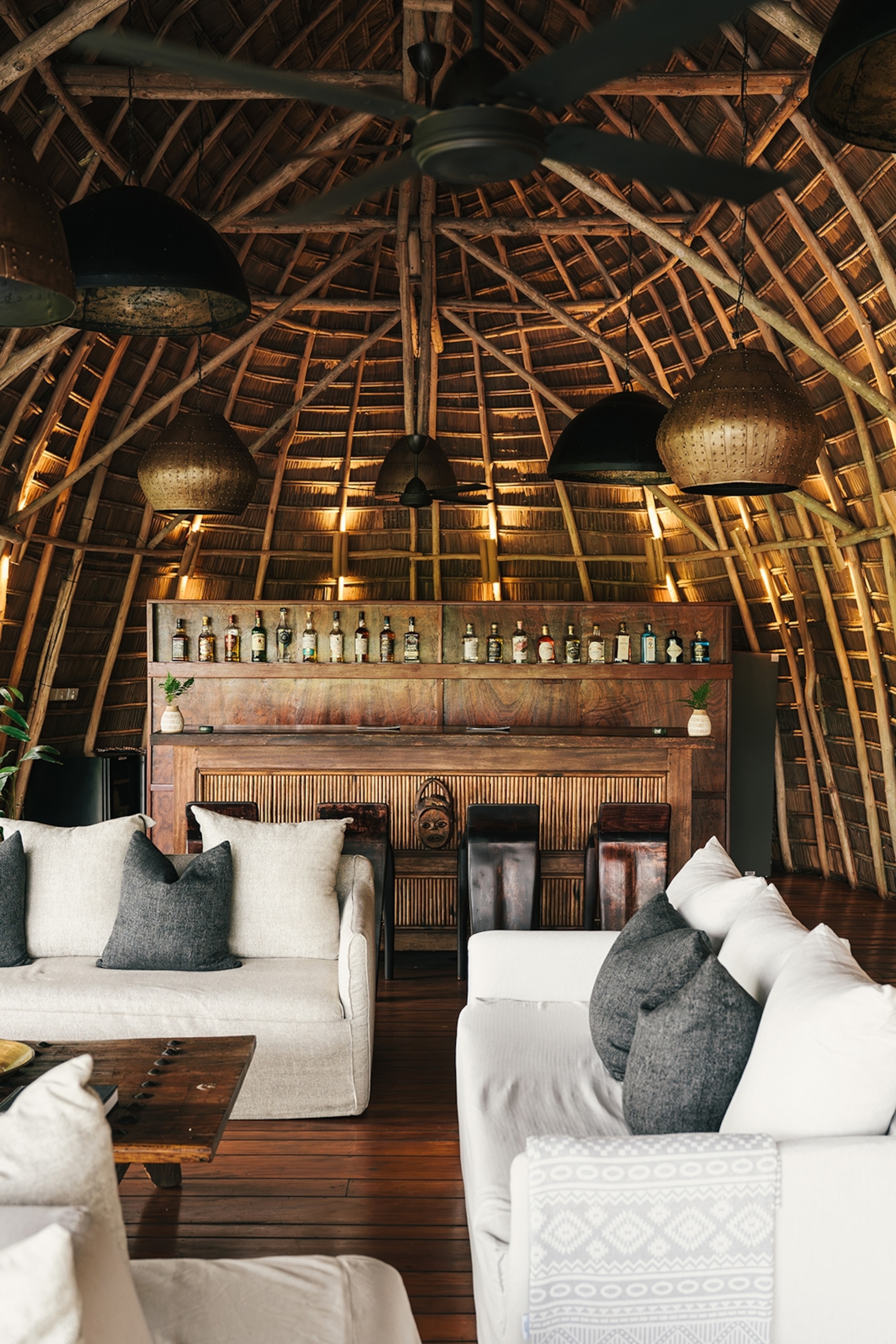 The interior of a wooden lodge with the building's skeleton revealed on the inside.