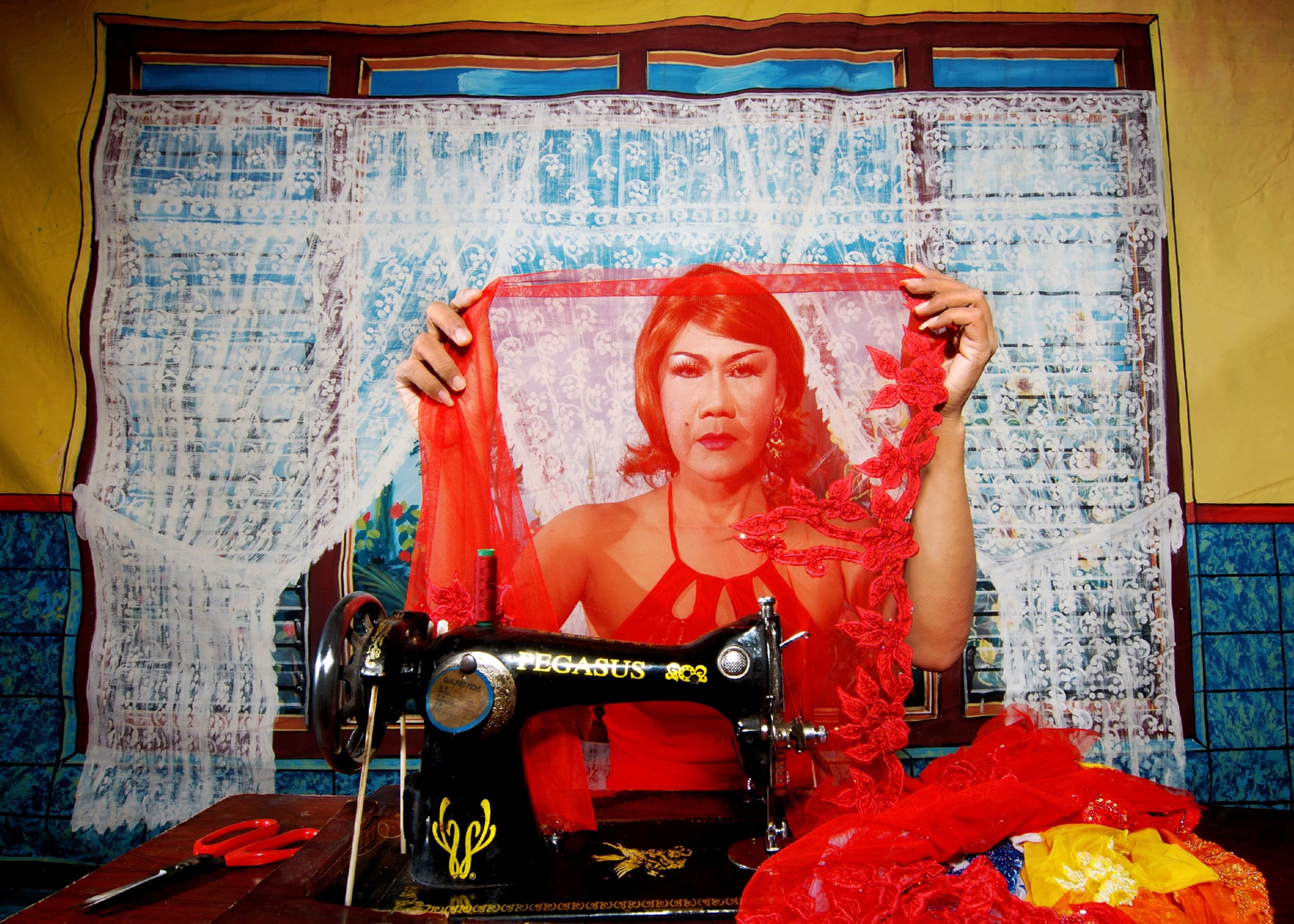 a Ludruk performer inspecting a costume