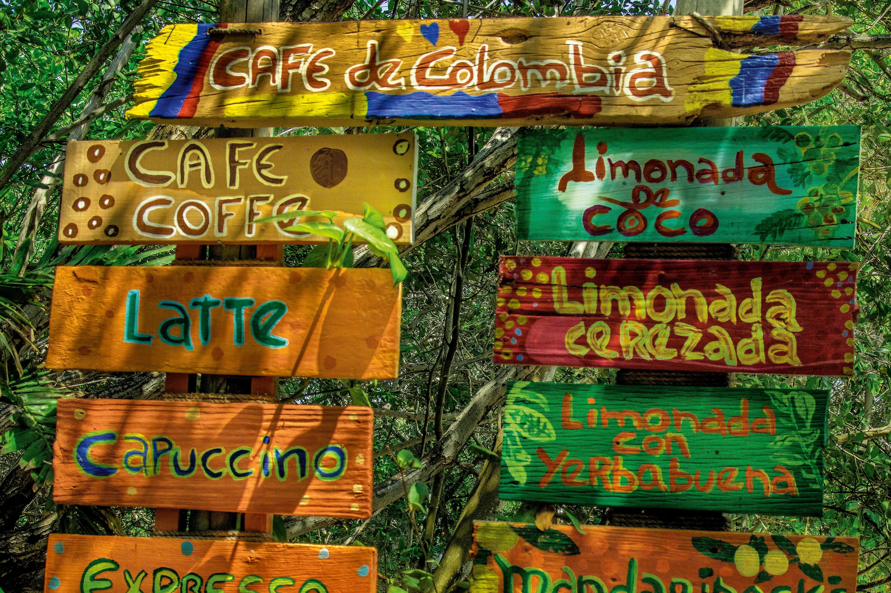 Red, yellow, orange and green wooden drinks menu for a cafe