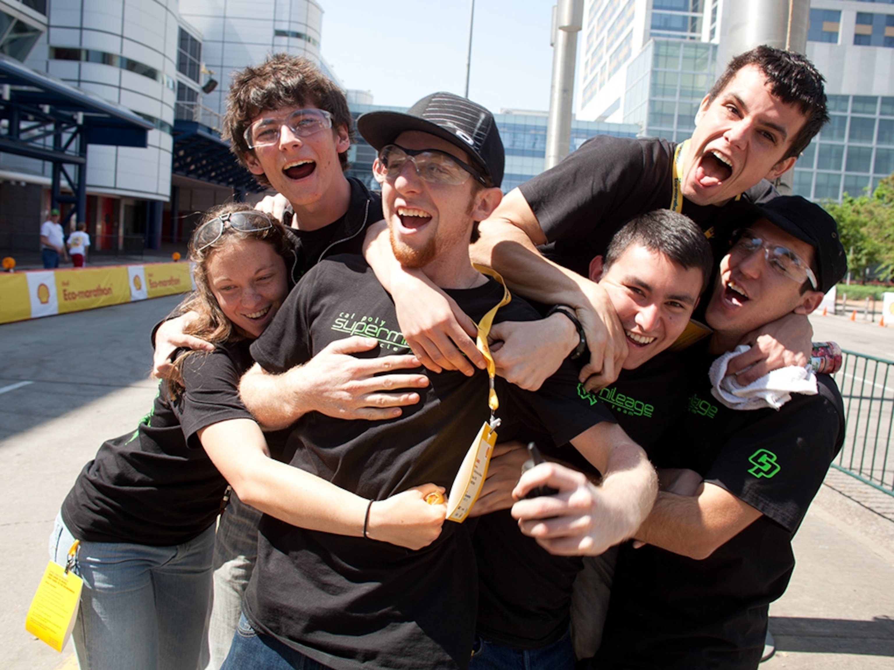 Cal Poly team mates mob team manager Gabriel Mountjoy, center, after seeing how little fuel was used in the tank of their Urban Concept car after running the first round of the Eco-marathon. Back left is Steve Janning. Back right is Myles Bradwell. Front, from left is Kyla Purvis, Mountjoy, Jose Garcia and Adriano Agostino.