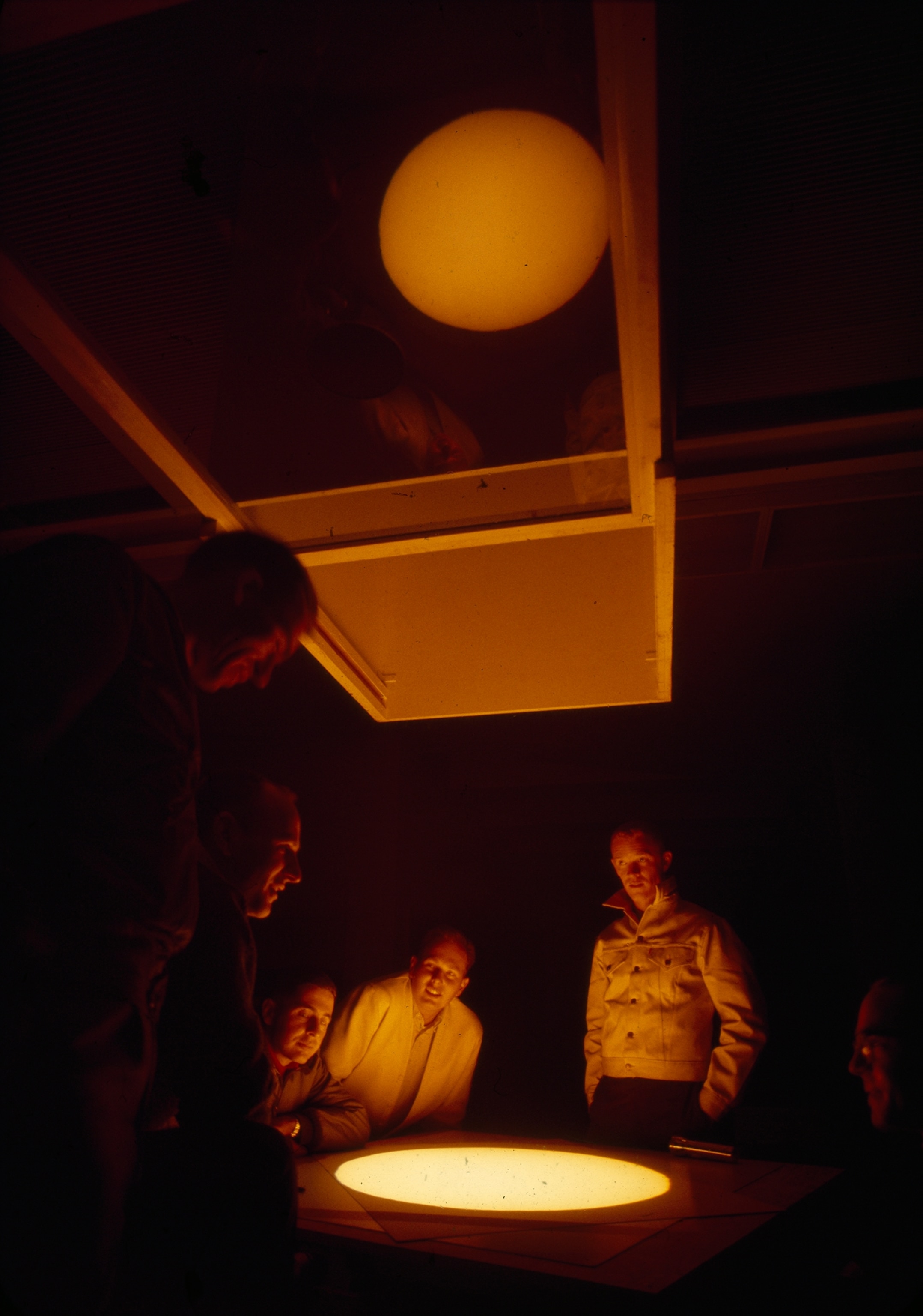 After studying lunar craters, astronauts watch sunrise on a telescope.