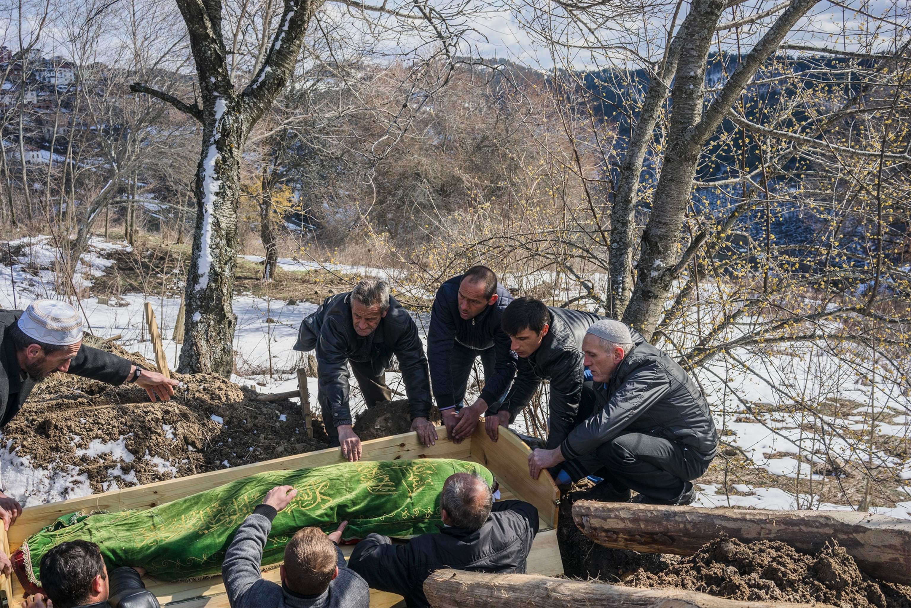 men carrying a coffin