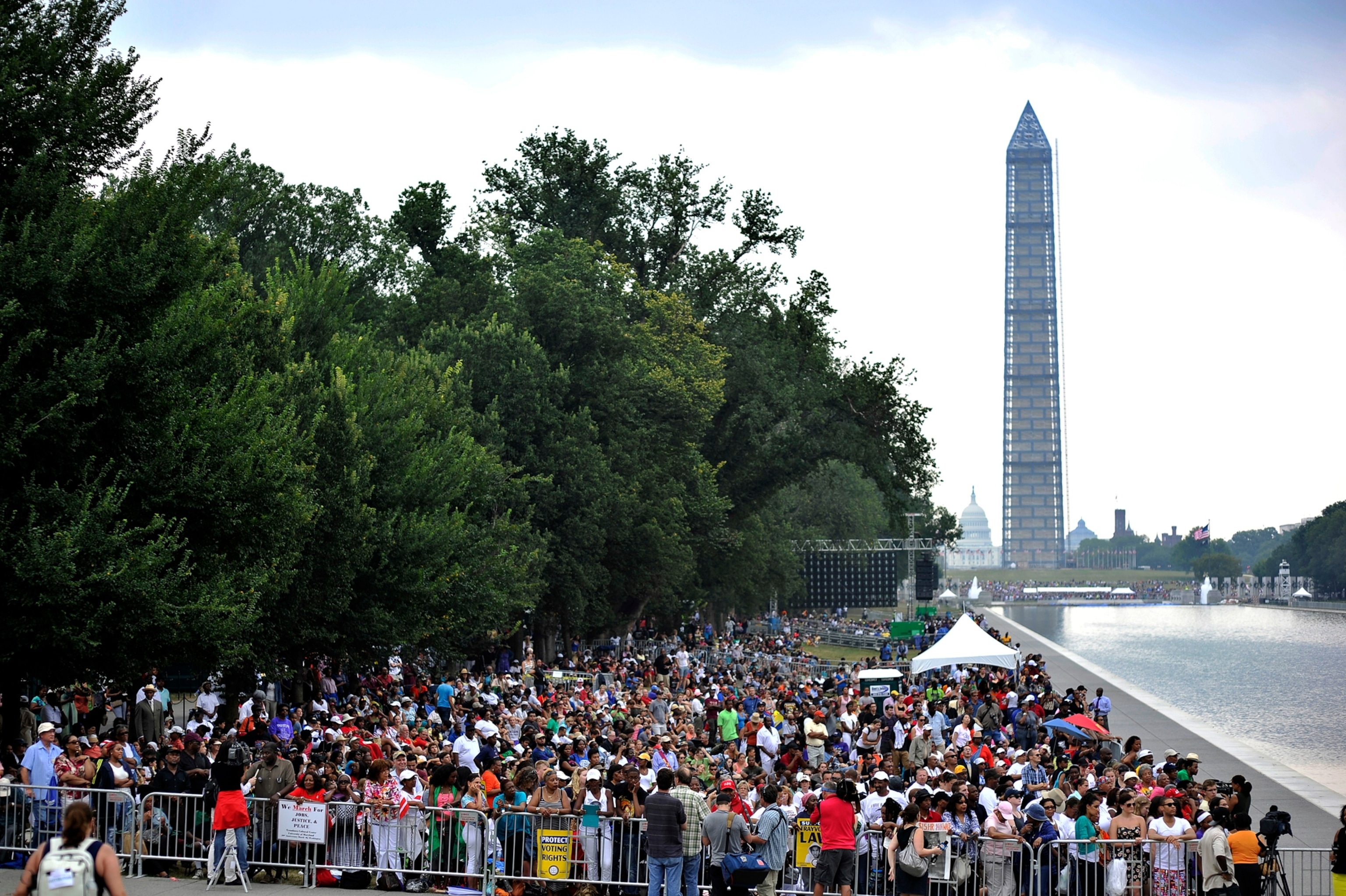 People listen to a speaker at the Lincoln Memorial.