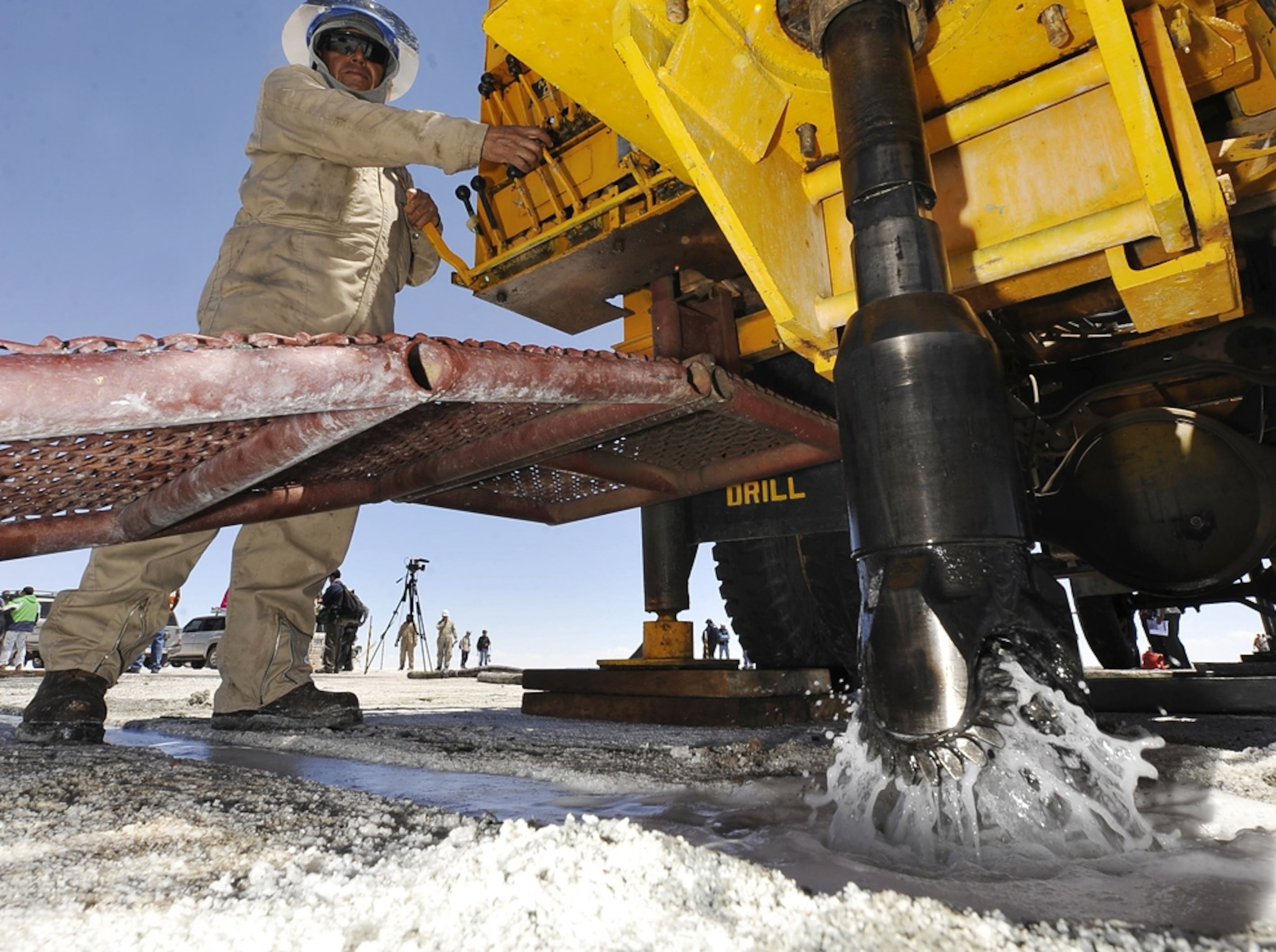 A worker operates a drill at the Uyuni salt flats