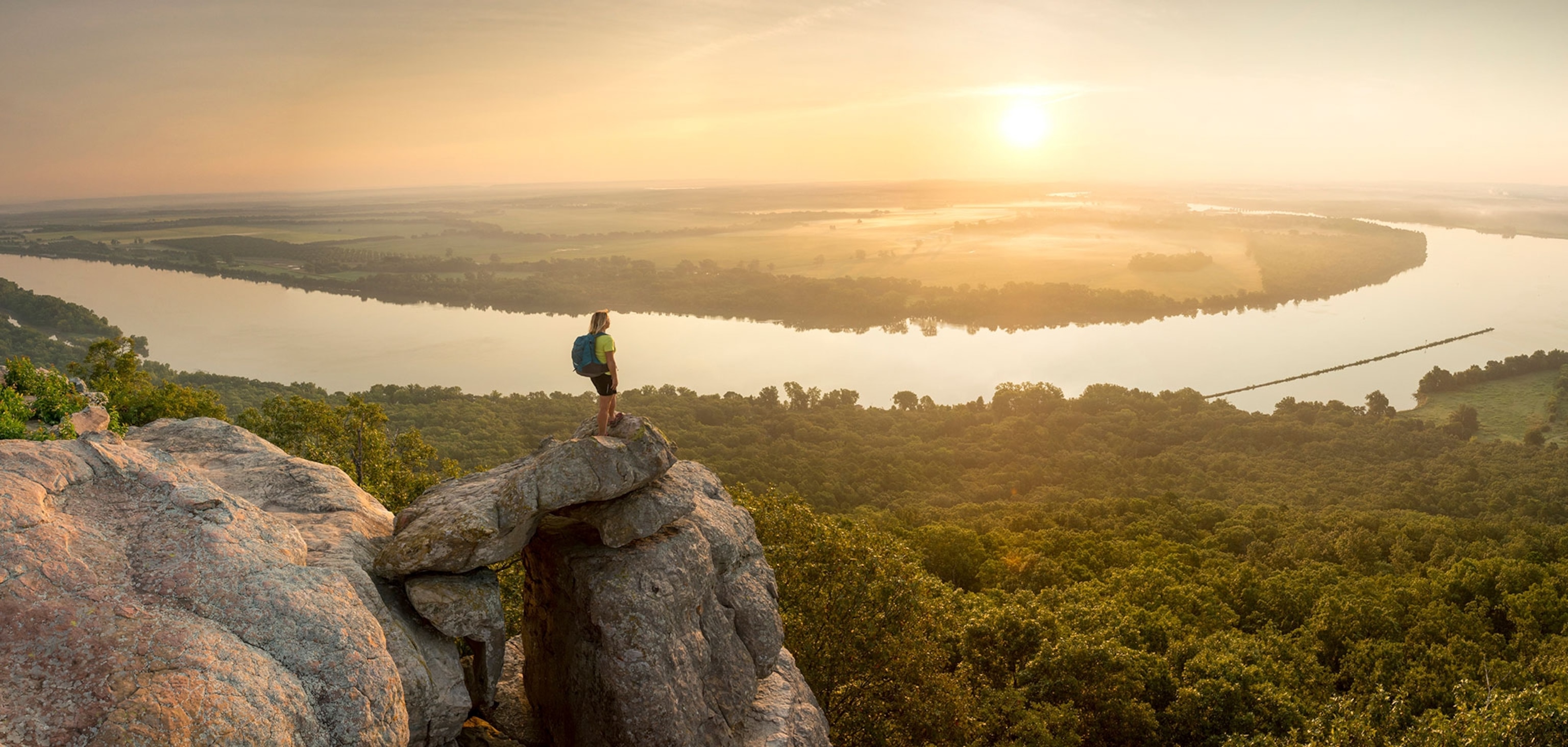 a hiker on Petit Jean Mountain above Arkansas River Valley, Arkansas